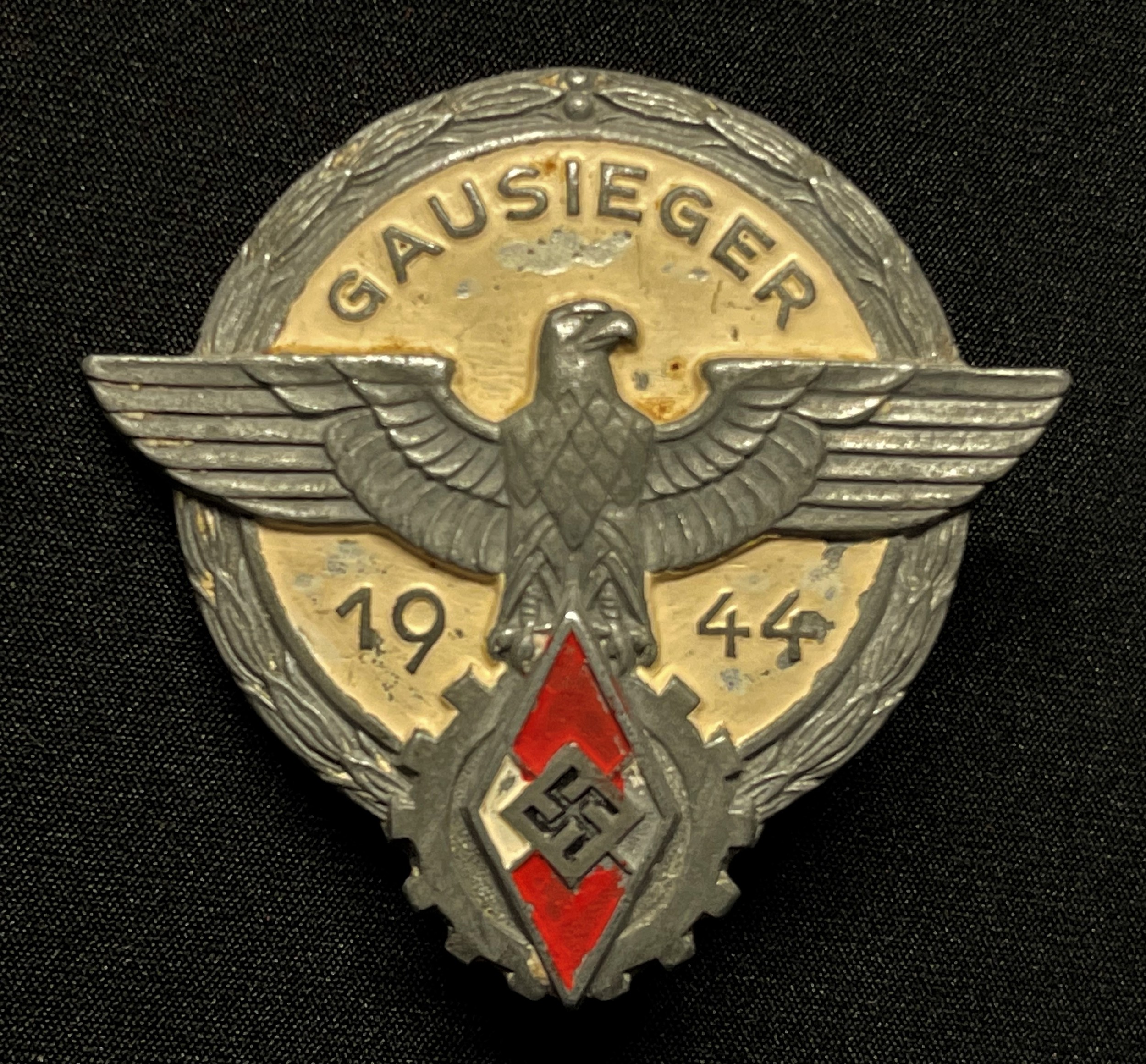 WW2 Third Reich Hitler Jugend Gauseiger Award 1944. Maker marked "G Brehmer, Markneukirchen". Typical late war example with painted finish.