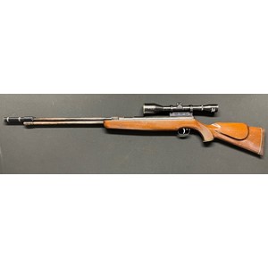 Weihrauch HW77 .22 cal Under Lever Air Rifle serial number 1180853. Barrel stamped "Hull Cartridge" and fitted with a Hull Cartridge Co Ltd Moderator. Barrel length 460mm. Fitted with a Hunter 6 x 45 Telescopic Sight. Overall length inc Moderator 121cm. Working order.