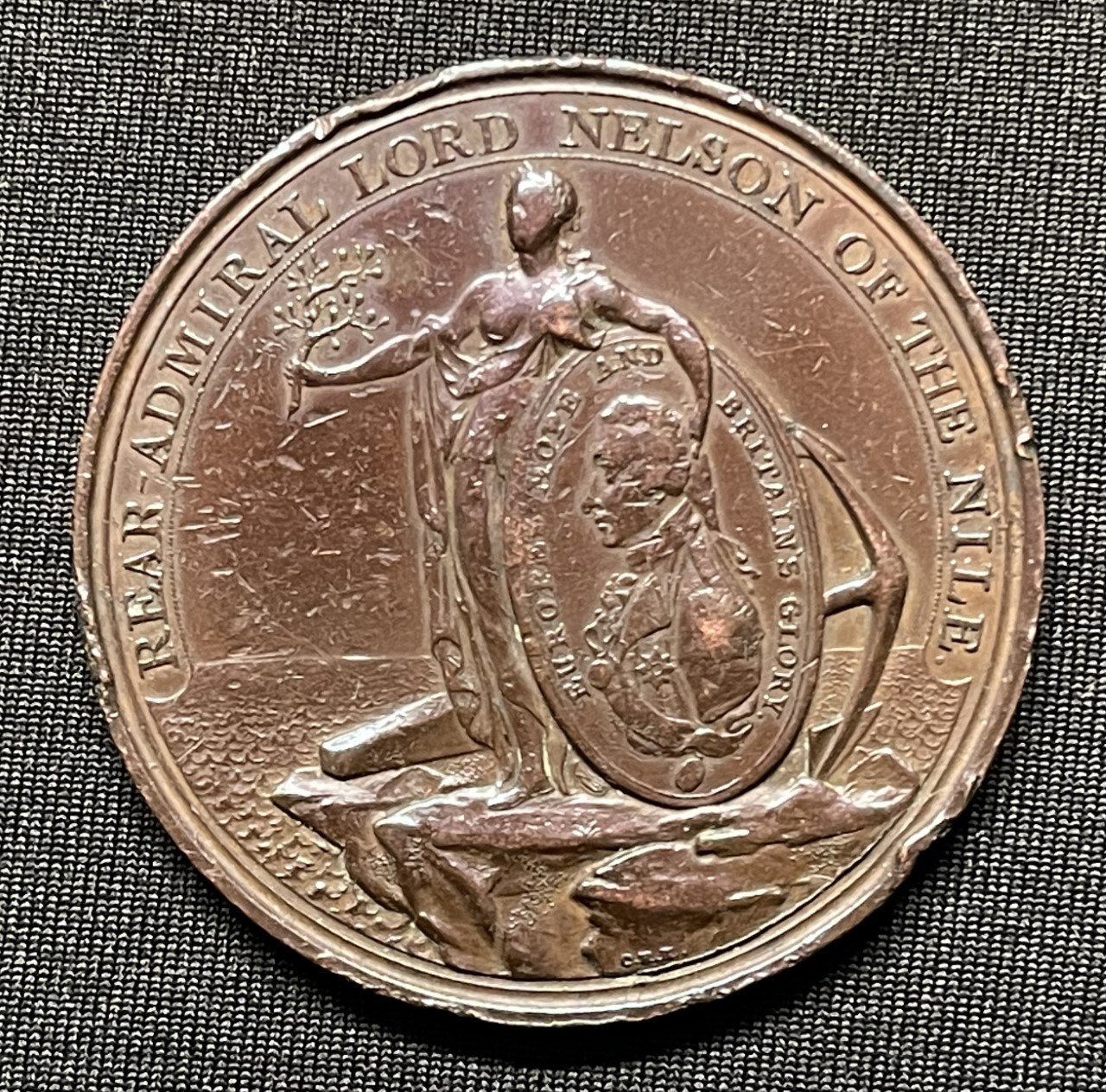 Davison Nile Medal for the Battle of the Nile 1798, in bronze. Obverse Britannia with anchor and Nelson portrait, reverse with battle scene, by C H Cuchler, 47mm diameter. Inscribed to the edge with "A Tribute of regard from Alexr. Davison Esq. St. James' Square".