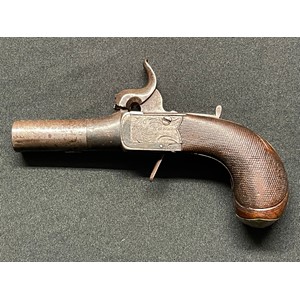 Percussion cap pocket pistol with 55mm long barrel. Bore approx. 11mm. Lock is signed "Rich. Hollis" along with "London". Blank Silver escutcheon plate along with silver mounts to checkered butt. Working action. Folding trigger. Safety catch. Overall length 147mm. Section 58 (2) no licence required.