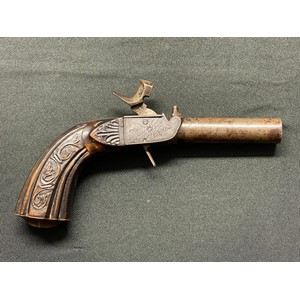 Percussion Cap Pocket Pistol with 62mm long barrel. Bore approx. 12mm. Unsigned. Barrel, hammer and lock all marked "38". Folding trigger. Working action, holds at both full and half cocked positions. Engraved Floral decoration to lock and trigger. Carved decoration to wooden butt. No makers marks or Proof marks. Overall length 173mm. Section 58 (2) no licence required.