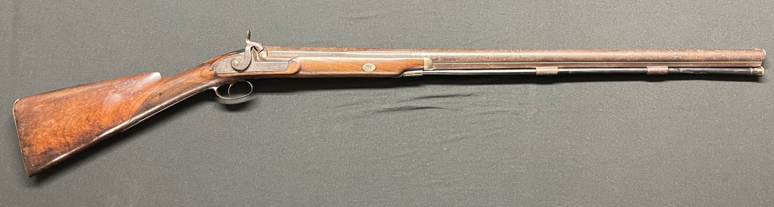 Percussion Cap Musket with 800mm long barrel. Bore approx. 19mm. Lock is signed "Dodson". Working order and will hold at both full and half cocked positions. Blank silver escutcheon  plate. Crack to stock. Complete with ramrod. Overall length 121cm. Section 58 (2) no licence required.