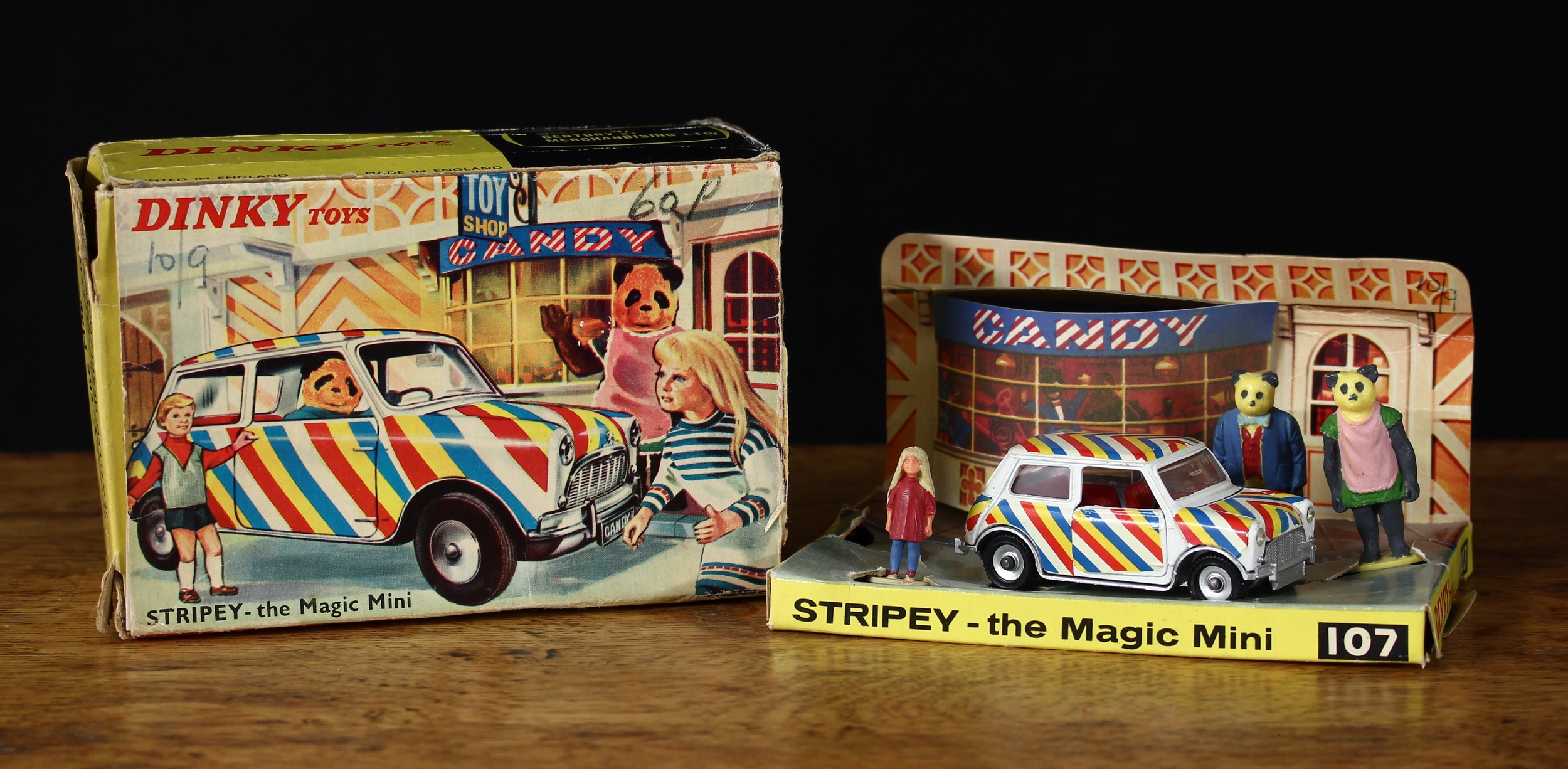 Dinky Toys 107 Stripey the Magic Mini, comprising white Mini with red, yellow and blue stripe decals, red interior and chrome spun hubs, boxed with inner cardboard display stand and Candy and the Bearandas plastic figures, produced between 1967 and 1968