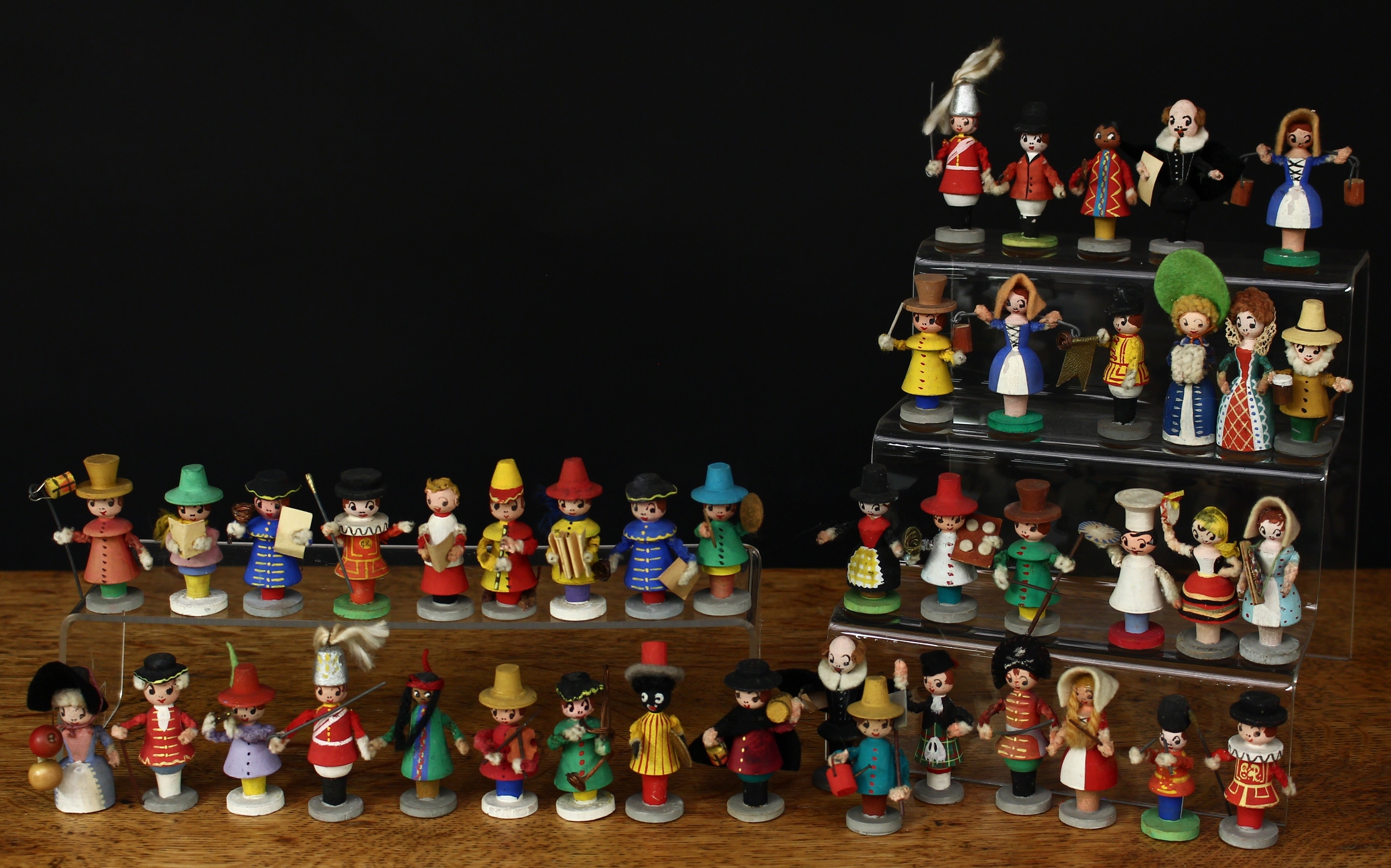 Folk Art – a collection of mid 20th century painted wooden miniature figures, probably from the Erzgebirge region, various poses and costumes (quantity)