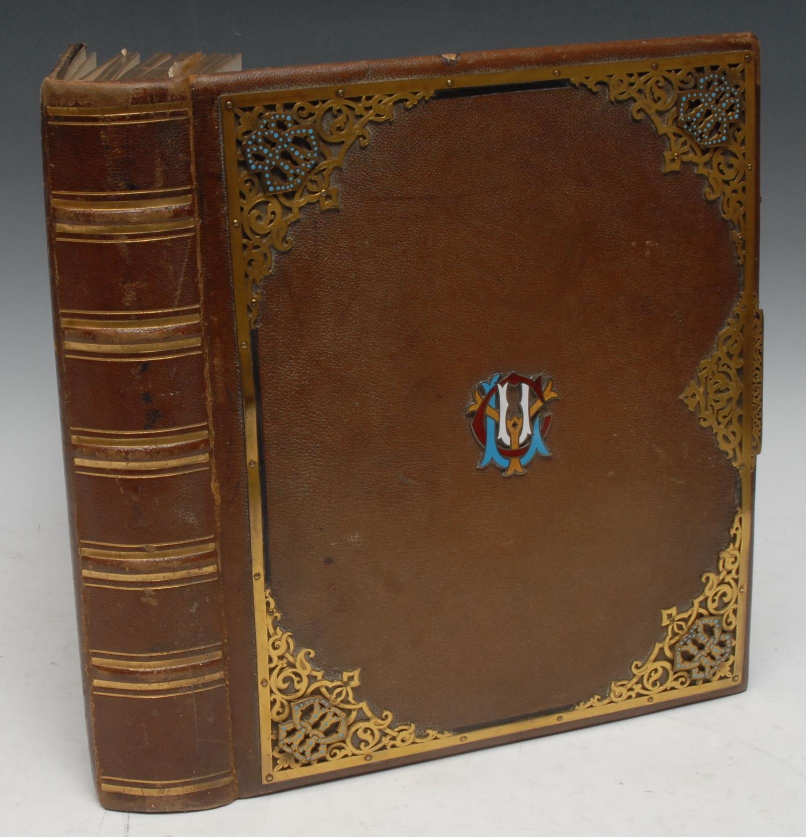 Photography - European Royalty and Nobility - a 19th century gilt brass and enamel mounted Asprey's patent photograph album, enclosing portrait photograph carte de visites of notable figures, including Napoleon III [Charles Louis Napoléon Bonaparte]; Empress Eugénie de Montijo; Louis-Napoleon, The Prince Imperial as a child; Franz Joseph I, Emperor of Austria; Empress Elizabeth of Austria; Marquis and Marquise de Caux; Sir J Kay Shuttleworth;  General Ridley and Aide de Camp; La Grand Duchesse; Sir T Lawrence; Reverend Dr Mortimer; others, many annotated, 33cm x 28.5cm