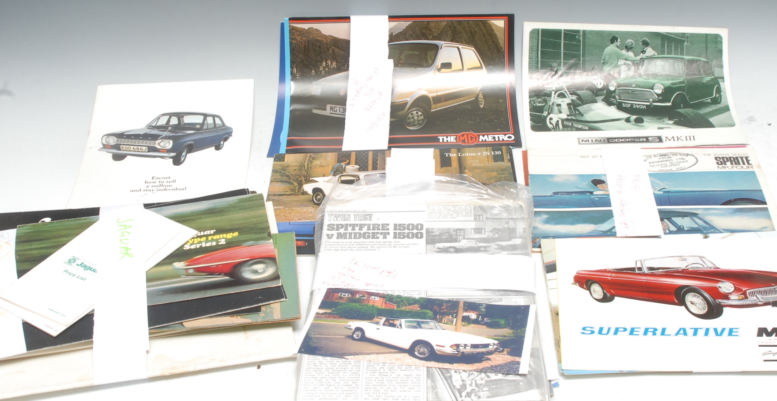 Automobilia - Classic and Retro Motor Cars - an interesting collection of sales brochures, 1960s and later; including 1960s MGB Superlative, 1800cc, chrome bumper; MGB and MG B Midget, price lists, colour charts, road test, etc; Jaguar brochures, Austin Morris; Austin Healey Sprite; Lotus; Ferrari; Ford Escort; other general sale brochures, Mini Cooper S, MG Metro; Triumph brochures; Midget 1500; V-Spitfire 1500; Auto Tests; Stag; The GT6; The Dolomite Sprint; The TR7, drop head and fixed head; colour charts, price lists; qty with some duplicate varieties of model and year