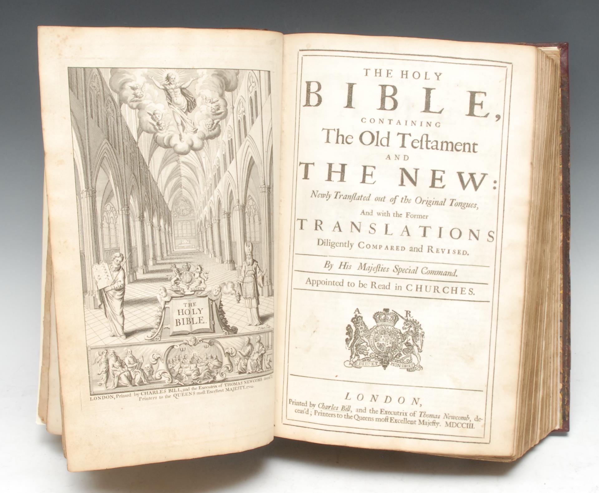 Bible, English King James Version -  The Holy Bible [...] [issued with and bound at the front] The Book of Common Prayer [...] Together with the Psalter or Psalms of David [...], London: Printed by Charles Bill, 1703, [as well as] The Whole Book of Psalms [...], London: Printed by W.B. for the Company of Stationers, 1703, BCP with an etched portrait frontispiece of Queen Anne, the Bible with an architectural frontispiece engraved by John Sturt (1658-1730) and dated 1704, the first three separate title-pages black-ruled and enclosing a woodcut of the Royal Arms of Queen Anne, their text printed in open double-columns, the Bible with historiated initials at the opening of each book and further illustrated with full-page plates engraved by Richard Blome, The Whole Book of Psalms printed in open triple-columns and terminating on [L2] (the whole volume not examined or collated prior) - the two extant leaves of signature L have been repaired and have some losses, rebacked and repaired contemporary panelled red morocco gilt, later marbled endpapers and flyleaves, folio (34cm x 24cm), [1]