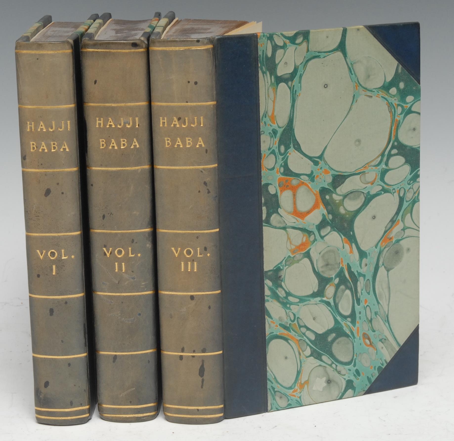 Persia and the Qajar Dynasty - Author's Presentation Copy, [Morier (Sir James Justinian)], The Adventures of Hajji Baba, of Ispahan, three-volume set, first edition, London: John Murray, 1824, half-titles present, pp: [ii], lxxv, [1] (blank), 272; [iv], 403, [i] (colophon); [iv], 388, [i] (colophon), 20th century blue half-calf gilt over marbled boards, by Paul Dodge of Leicester, loosely-inserted MS note, contemporary red-speckled edges, 12mo, [3] 