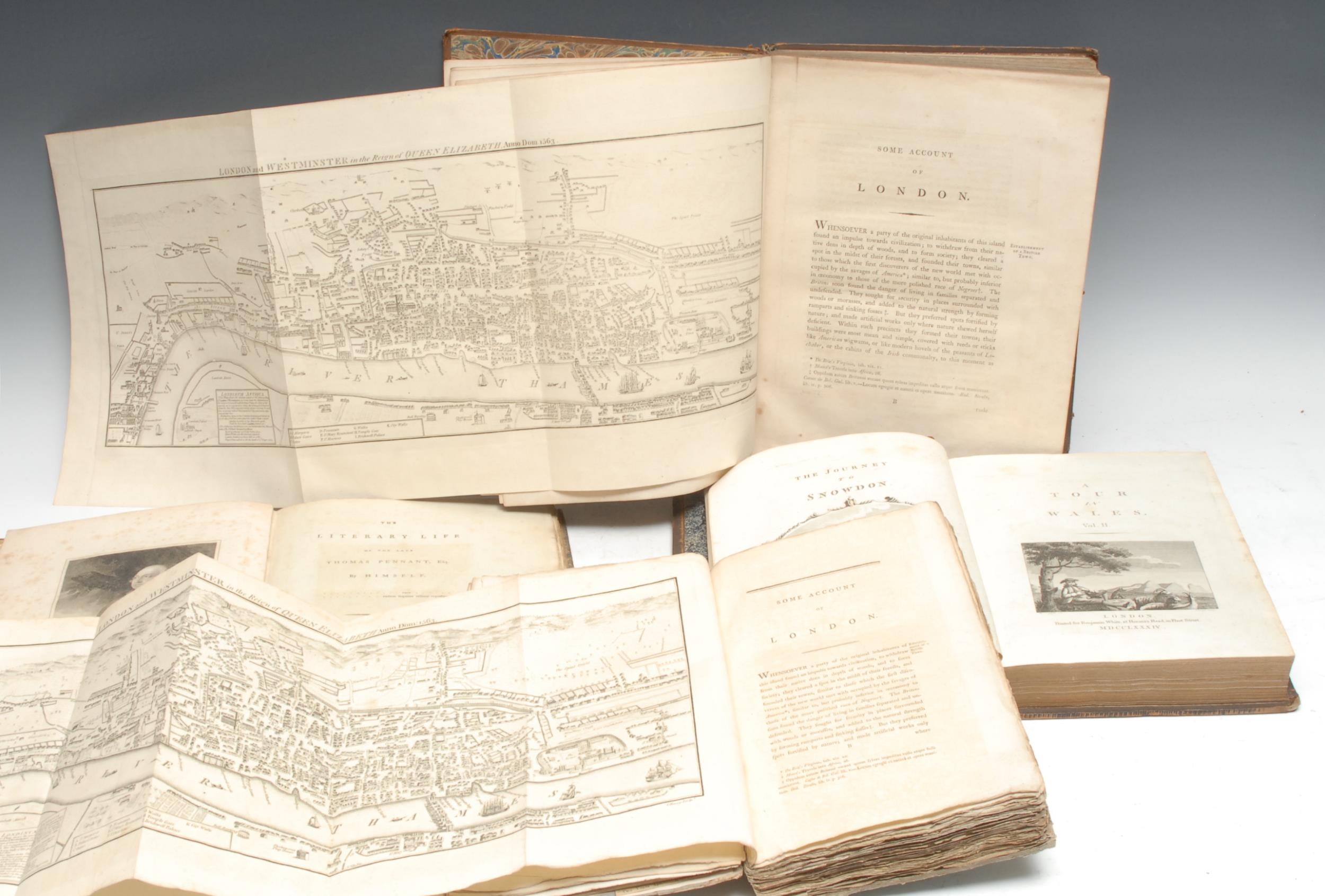 Pennant (Thomas): Some Account of London, The Fourth Edition, with Considerable Additions, large paper copy, London: Printed for Robert Faulder, 1805, pp: [vi], 415, [8] (index), illustrated with 112 engravings (including the fold-out panorama of Elizabethan London), contemporary diced calf, gilt double-fillets and blind-rolled with anthemions, marbled edges and endpapers, 4to, (1); the third edition, [London]: Printed for John Archer, 1791, some plates, contemporary publisher's boards only (perished spine), upper-cover with contemporary bookseller's ticket: Grant Bolton & Co., Dame Street, Dublin, some indistinct early 19th century and later ownership inscriptions, loosely-inserted ephemera, 8vo, (1); The Literary Life of the Late Thomas Pennant, Esq., first edition, London: Sold by Benjamin and John White [...], 1793, pp: [vi], 144, illustrated with 4 engravings (including the hand-coloured satirical Church Militant caricature), rebacked contemporary marbled boards, edges uncut, 4to, (1); A Tour in Wales, volume II only, London: Benjamin West, 1784, illustrated, contemporary diced calf blind, 4to, (1), [4]