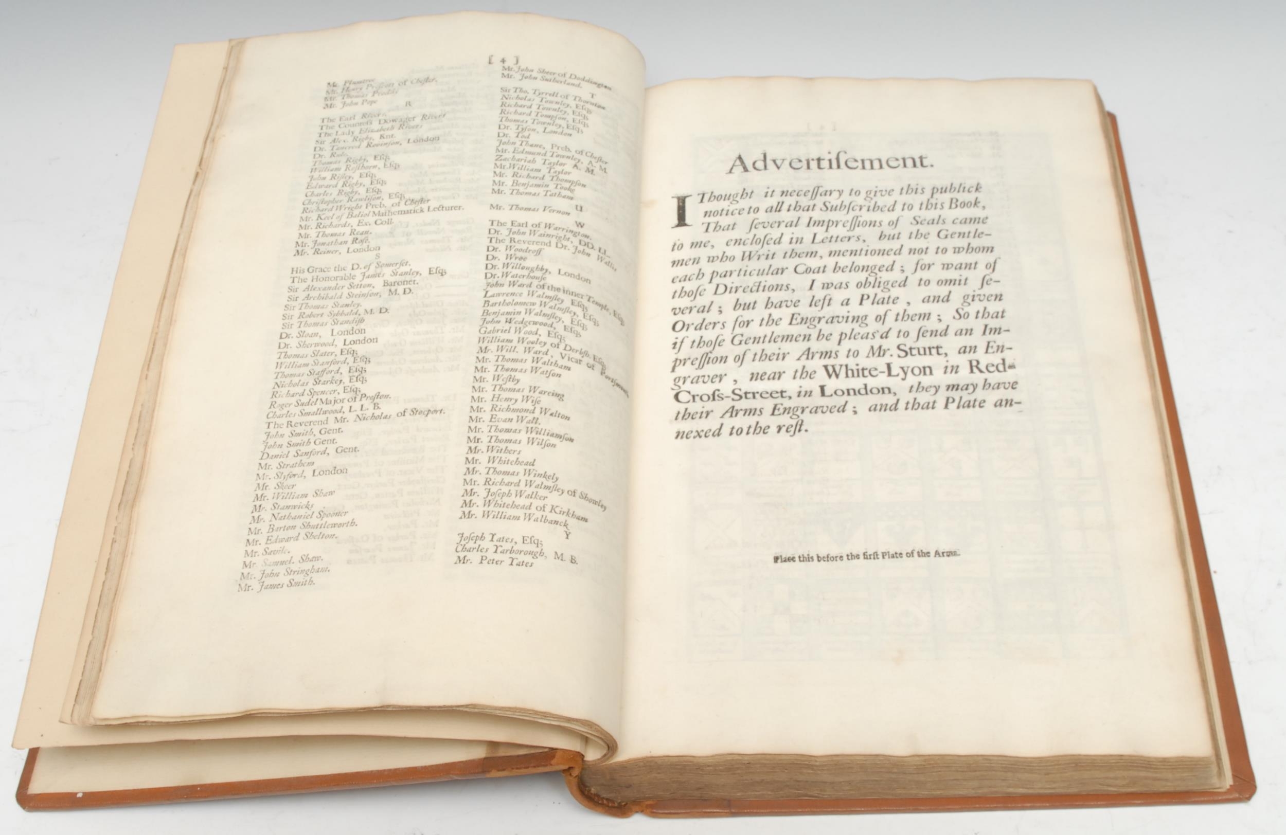 Local Interest - Leigh (Charles, Doctor of Physick (sic)), The Natural History of Lancashire, Cheshire, and the Peak, in Derbyshire: with an Account of the British, Phœnician, Armenian, Armenian, Greek and Roman Antiquities in those Parts, first edition, Oxford: Printed for the Author [...], 1700, black double-ruled title, lacking portrait frontispiece; pp: Book I: [xxii], 4 (subscribers), [2], 2 plates of coats of arms, 2-page county map by Herman Moll, 164, [1] (errata), [165-196] with 9 copperplate etched plates; Book II: [ii], 97, [1] (blank), [i] (errata), 1 copperplate etched plate; Book III (mispaginated but complete): 79, 72-80, [iii] (postscript and errata), 81-112 with 10 copperplate etched plates, [35] (index and advertisement), [1] (blank), late 19th/early 20th century tan morocco over textured buckram boards, folio (36.5cm x 24cm), [1] 