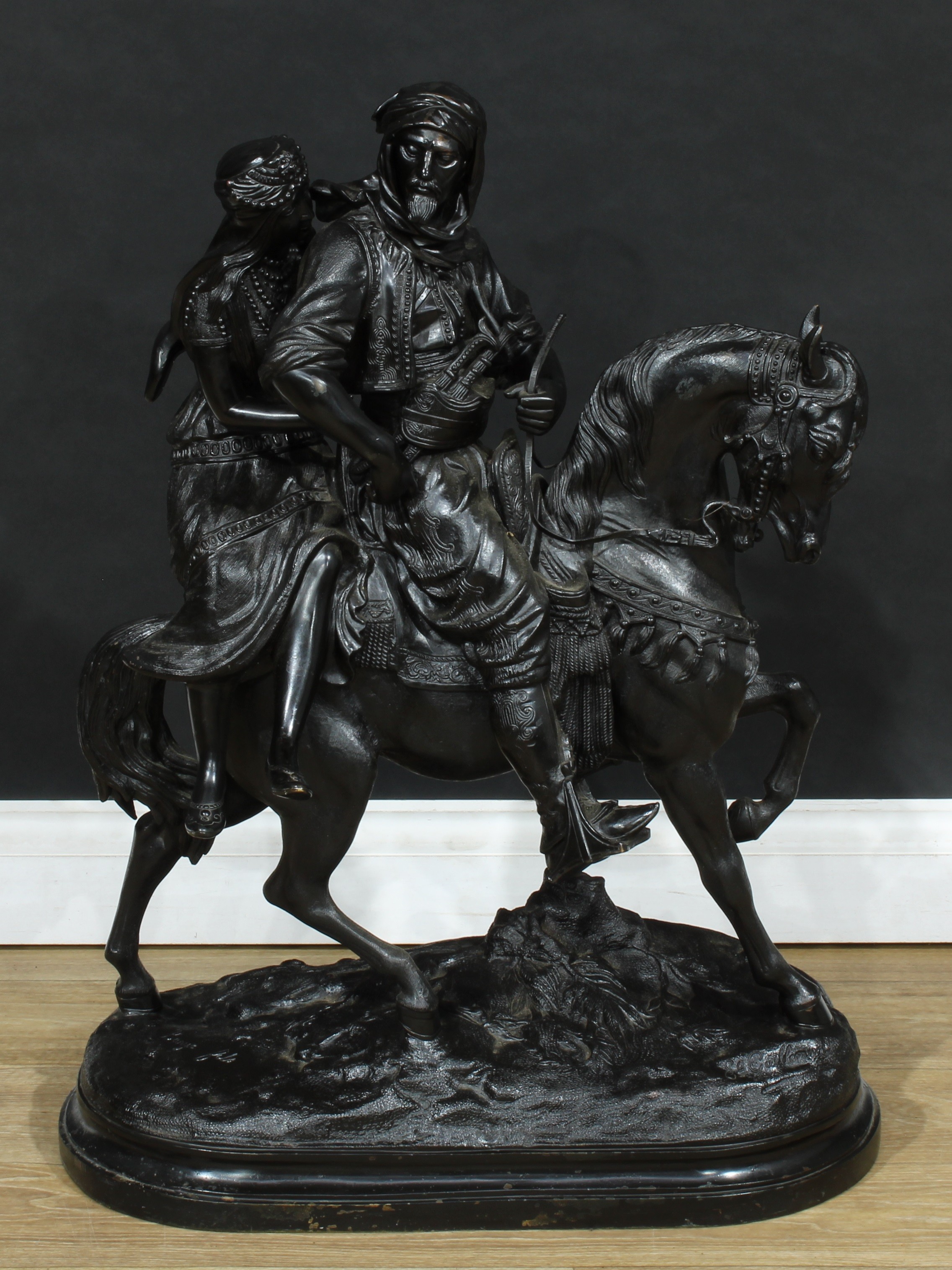 Émile Guillemin (1841-1907), a large dark patinated Orientalist bronze, Arab and his lady on horseback, signed in the maquette, oval base, 82cm high