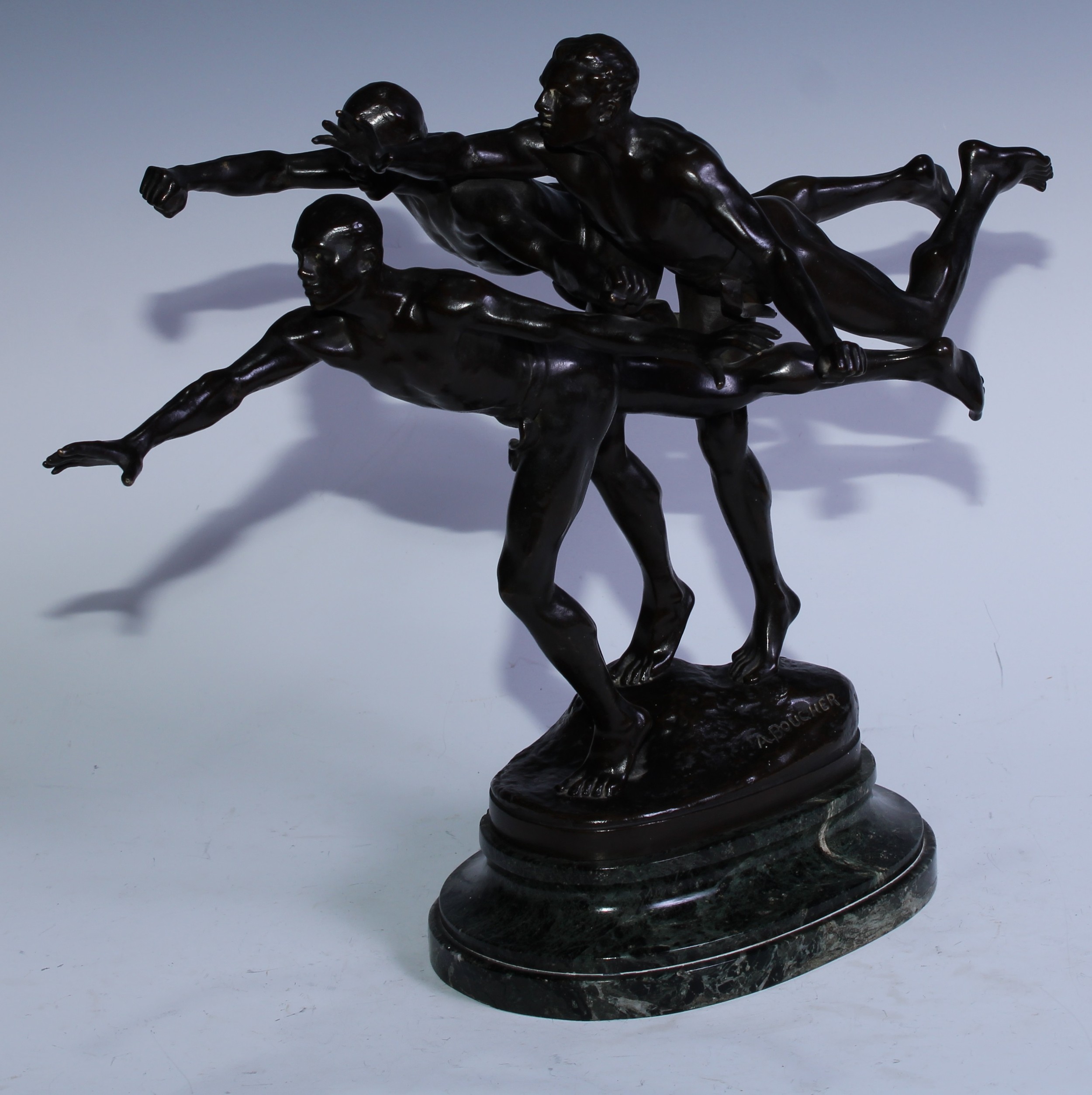 Alfred Boucher (1850 - 1934), 'Au But', A dark patinated bronze, signed A Boucher, Siot-Paris foundry mark and 436d, stepped spreading oval variegated green marble base, 31cm high, 41cm long  The plaster version of 'Au But', or 'To the Goal', was exhibited at the Paris salon of 1886 and won a first class medal. The state awarded Boucher the Chevalier de la Légion d’Honneur and commissioned a life size bronze version of 'Au But'. The finished sculpture was exhibited at the Salon in 1887 before being placed in the Luxenberg gardens. It remained here until its destruction under the Nazi occupation.