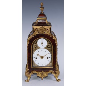 A George III ormolu mounted mahogany petite sonnerie table clock by Marriott, London, of small size, 9.5cm enamel dial with Roman and Arabic numerals and strike silent dial to arch, brass foliate spandrels, twin winding holes, the quarter striking 8 day movement with verge escapement striking on the hours on one bell and the quarters ting tang on two bells, the back plate engraved and chased with foliate scrolls and cartouche inscribed Marriott, London, the case with pagoda top, flame finial and pierced sides, acanths scroll feet, applied overall with ormolu leaves, scrolls and husks, 40cm high overall, c.1785  John Marriott, clock maker of Fleet Street, London was apprenticed until 1755 and free of the clock makers company from 1768 until his death in 1824. He made clocks for the Turkish and Chinese export market including many musical. A fine musical and automaton clock by Marriott is now in the Palace Museum, Beijing.