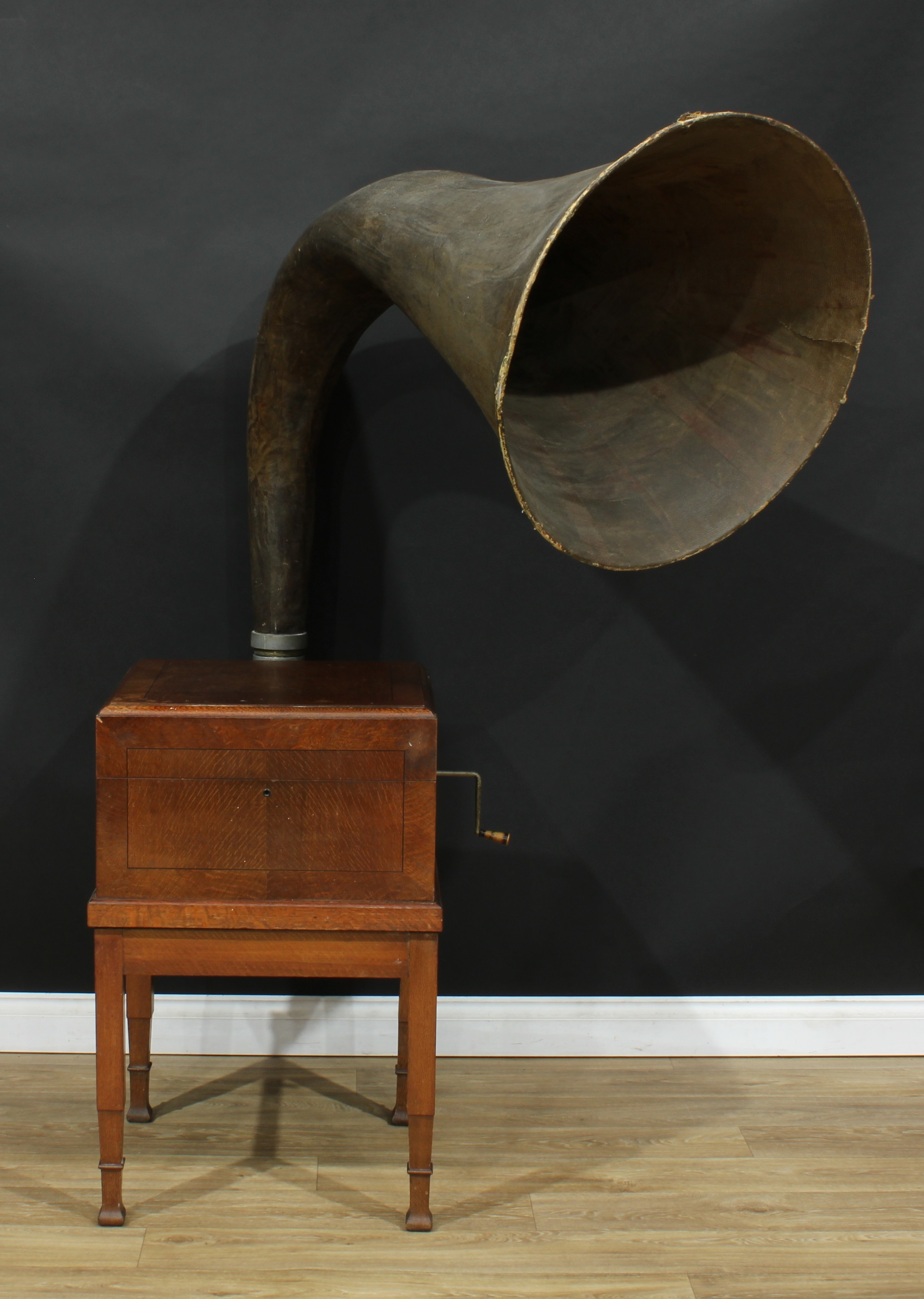 An early-mid 20th century phonograph or gramophone, of country house proportions, substantial faux-shagreen horn, the turntable underside marked Collaro Gramophone Motors, 179cm high overall, the case 87cm high, 57.5cm wide, 57cm deep, the horn opening 72cm diameter