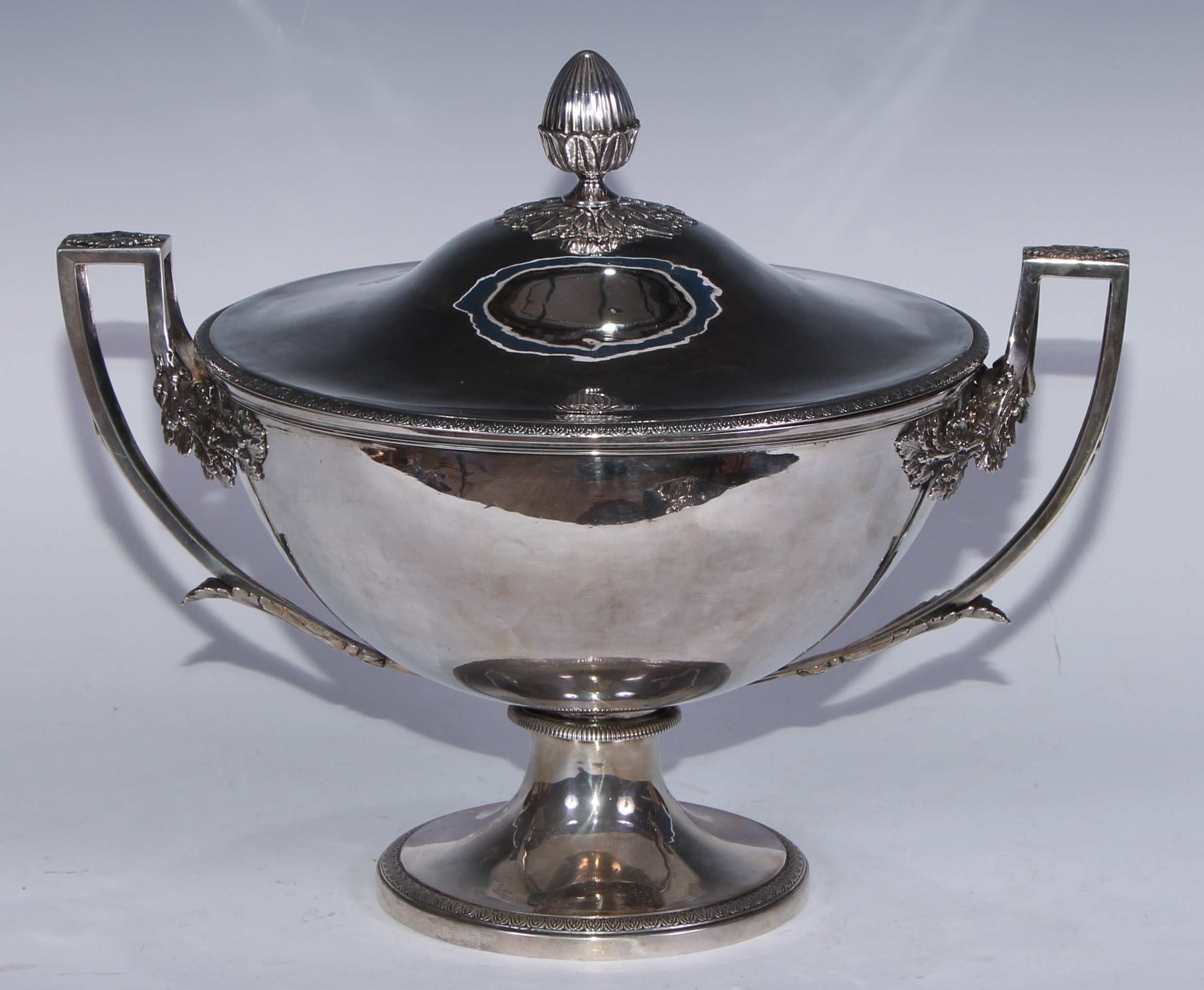 A French silver pedestal soup tureen and cover, bud finial, open angular scroll handles terminating in fruiting oak bosses, anthemion borders, 36cm wide, Pellerin & Leoming, Paris c.1870, 1686g