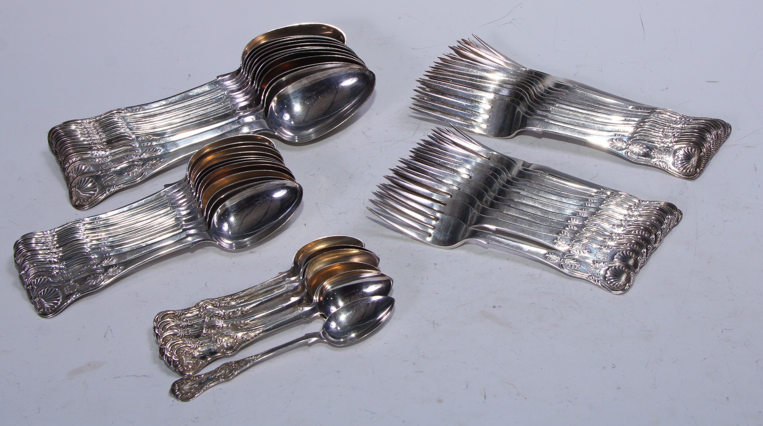 A set of eight  Victorian Kings pattern table spoons,  Jonathan Millidge, Edinburgh 1860;  another, four, similar, Edinburgh 1859;  a set of twelve dinner forks, Jonathan Millidge, Edinburgh 1861;  eleven dessert forks, Edinburgh 1859;  another, Edinburgh 1860;  a set of twelve dessert spoons, Edinburgh 1860;  a set eleven teaspoons, Edinburgh 1854, 3030g (97.74ozt)