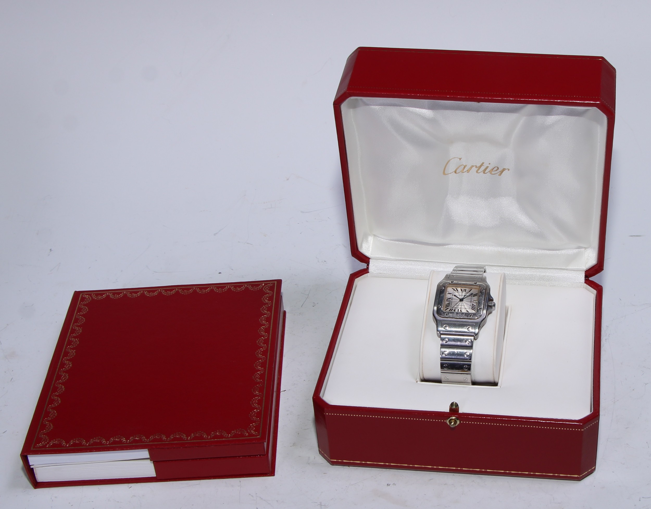 Cartier  - a Santos stainless steel automatic bracelet wristwatch, ref 2319, textured dial, bold Roman numerals, inner minute track, blued hands, date aperture, automatic movement, serial No 954996CD, boxed with certificate dated 14/6/2003, instruction booklet
