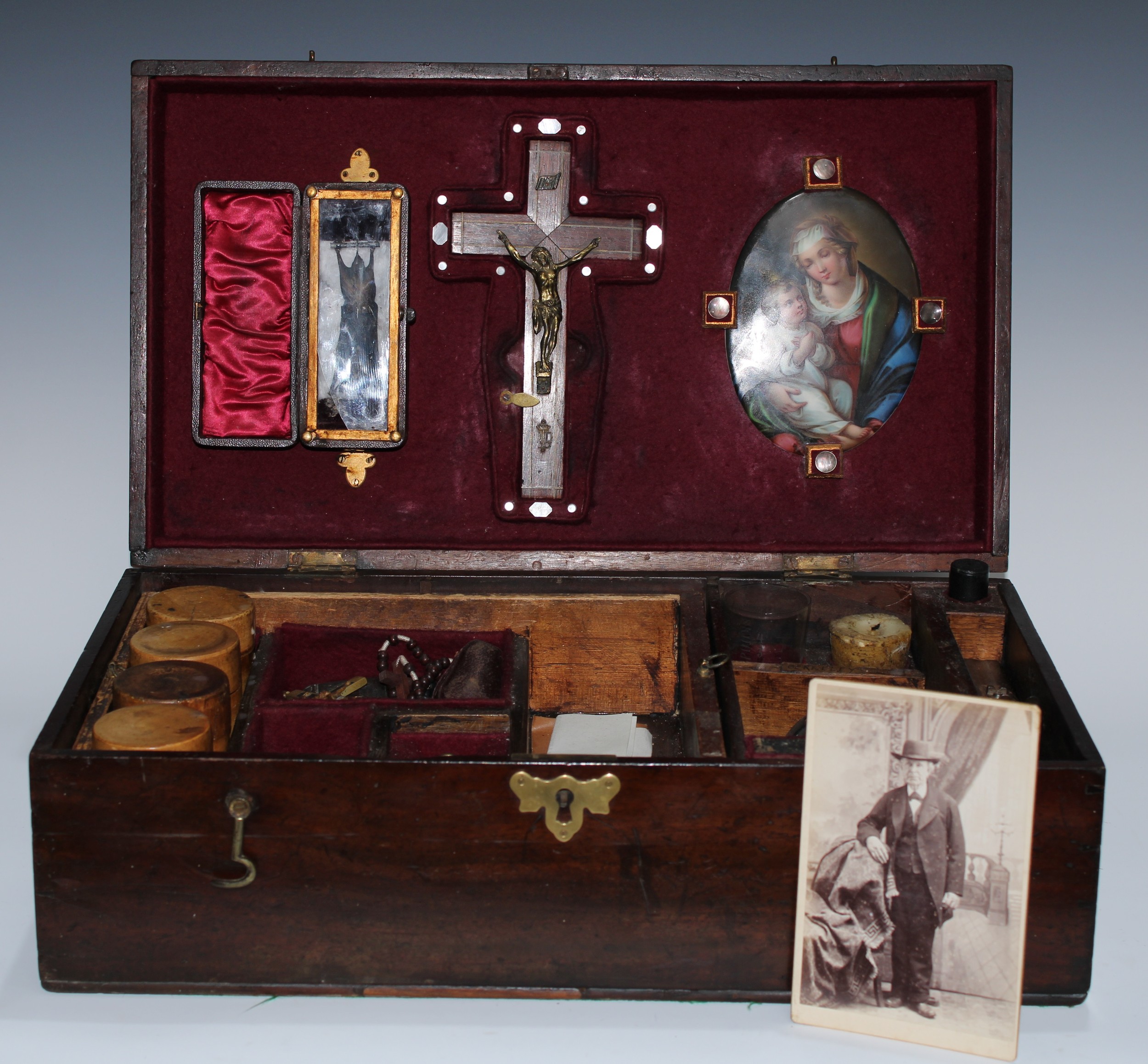 The Occult and the Gothic Macabre - an apocryphal vampire slaying kit, the 19th century mahogany box enclosing corpus Christi, a double barre;l pistol, lamp, bat, syringe, apothercary utensils Bible and an arrangement of further hunter's requisites,  49.5cm wide