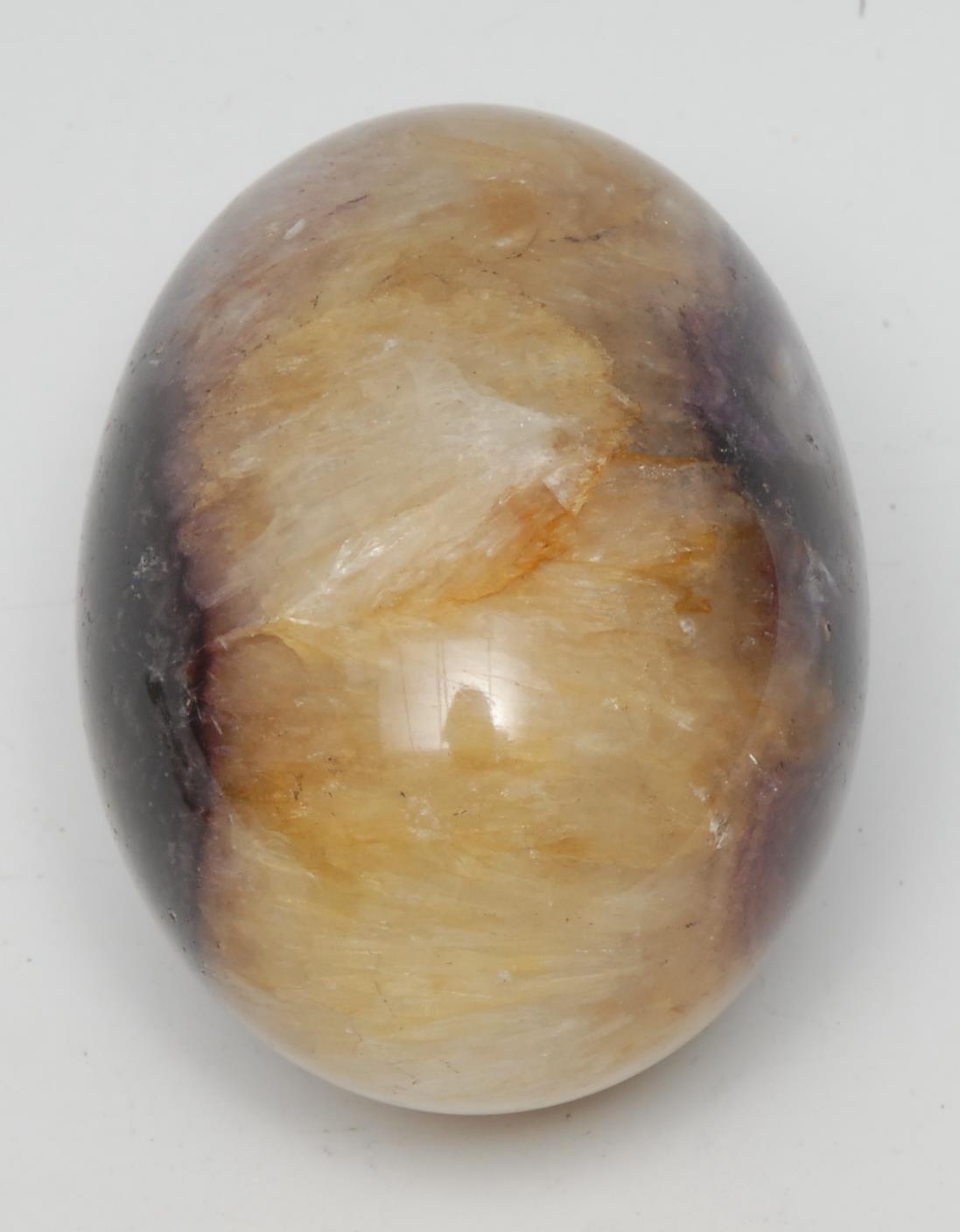 A substantial Derbyshire Blue John fluorspar novelty desk weight, an egg, 7.5cm long, 5.5cm wide, 360.80g, Wynatts One Vein, Castleton
