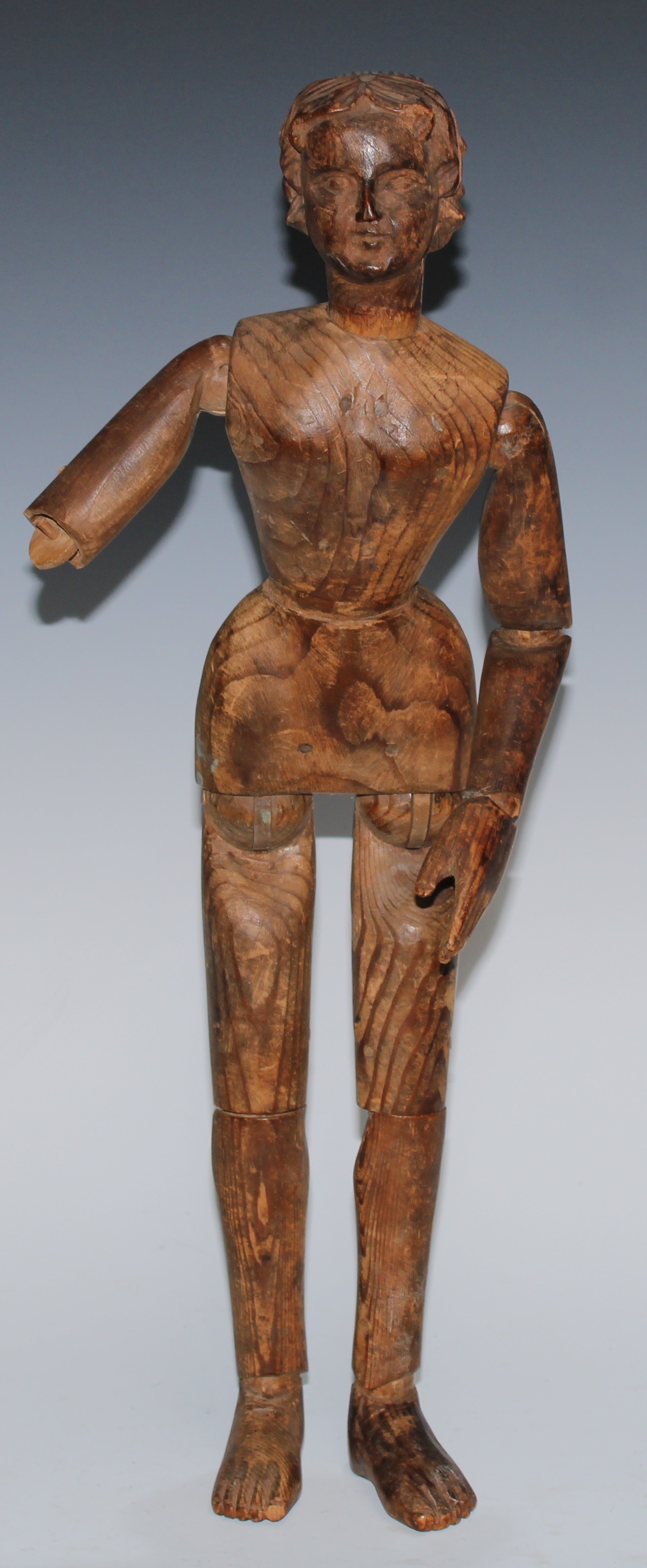 A 19th century softwood artist's lay figure, of typical form, the articulated head with carved features, 49cm
