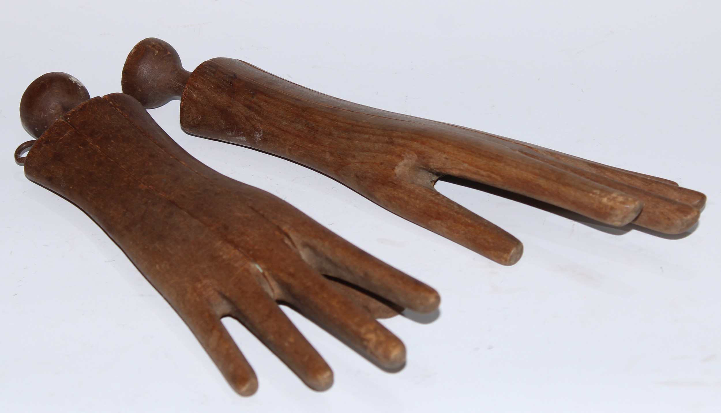 Treen - a pair of tailor's beech mannequin hand trees or glove-making stretchers, 31.5cm long, 19th century