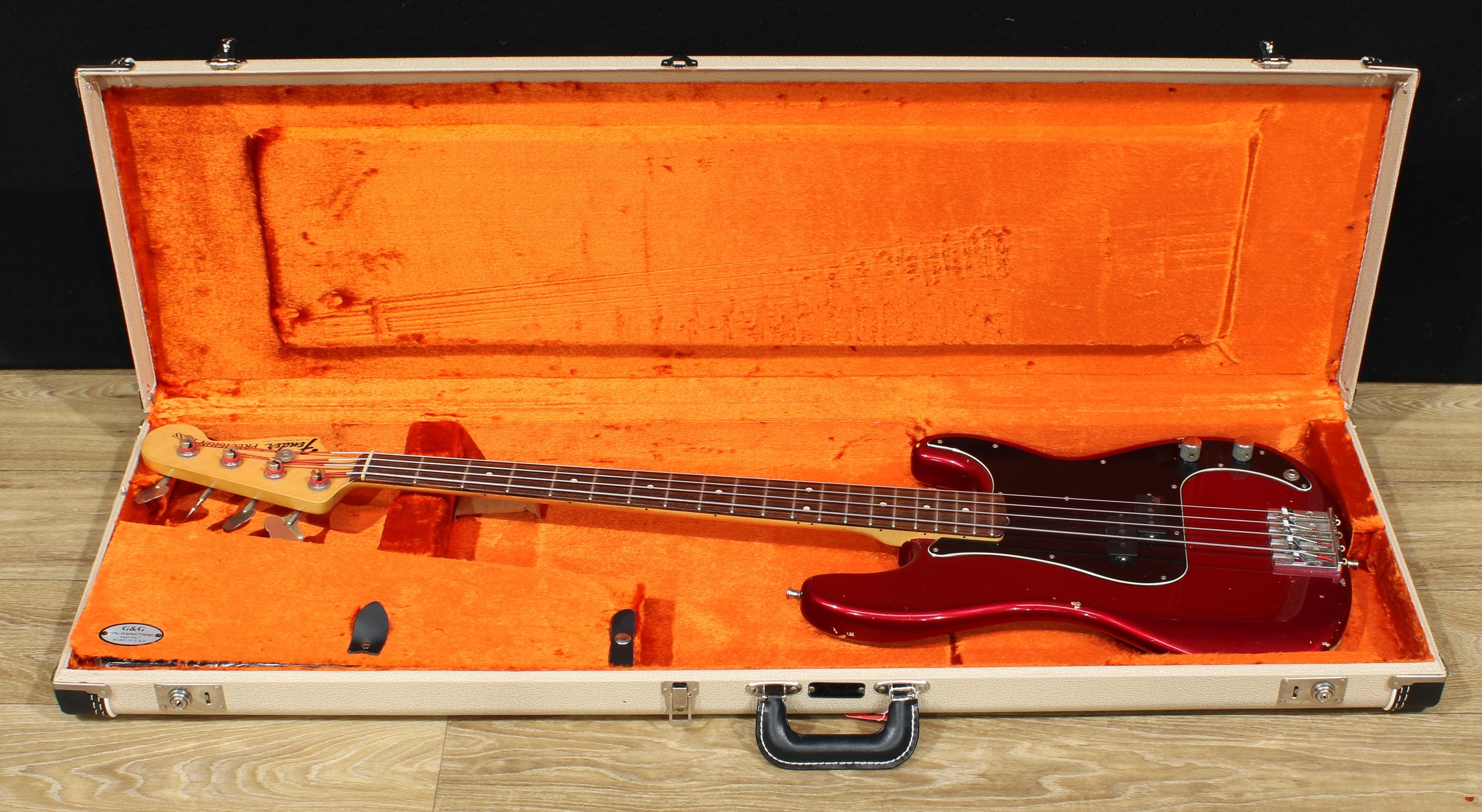 A Fender Precision Bass guitar, made in Mexico, numbered MX13337247, candy apple finish, 116cm long, cased