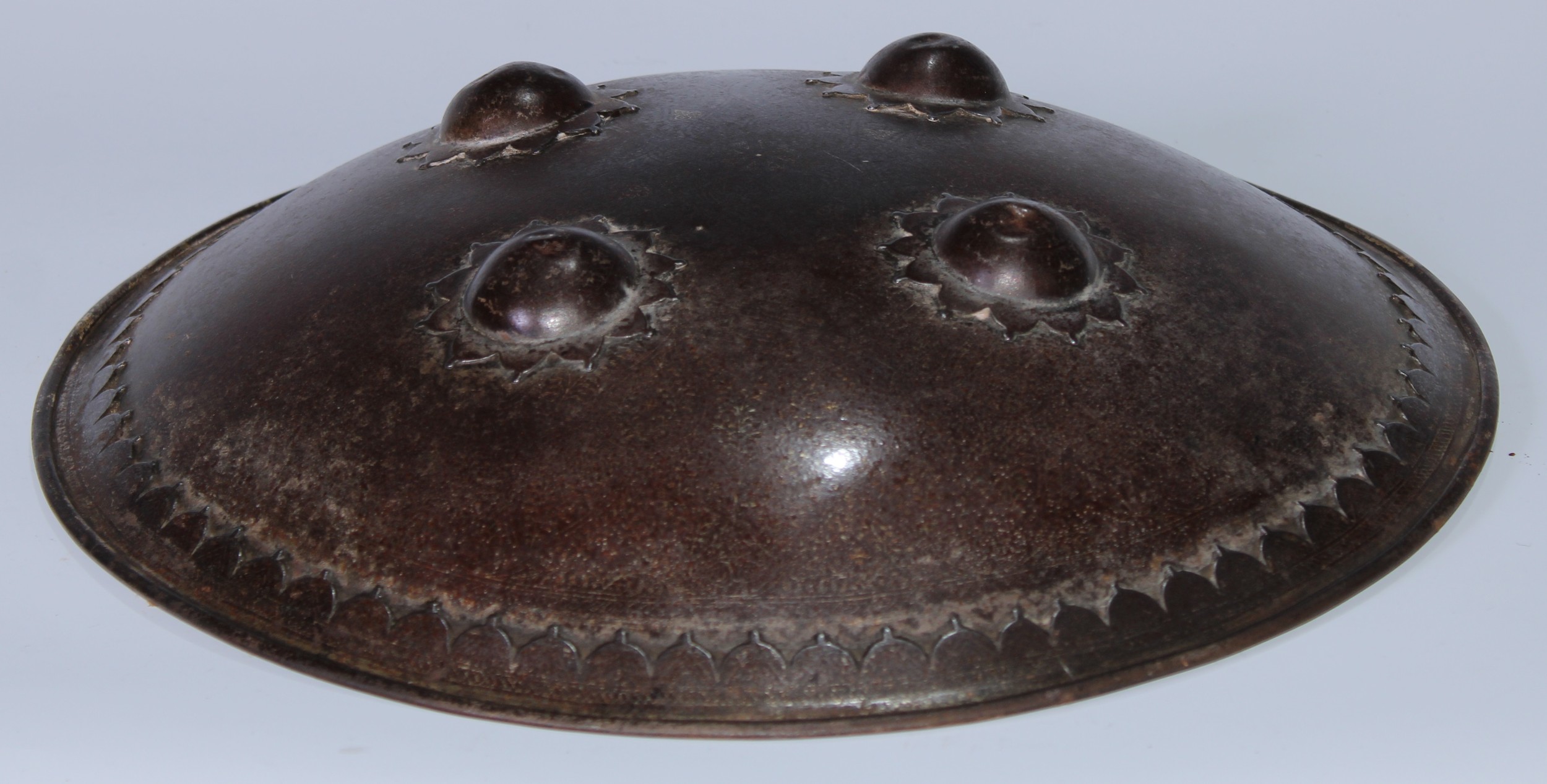 A Persian steel dhal shield, typically domed and applied with four bosses, traces of koftgari decoration, 35cm diam, 19th/early 20th century