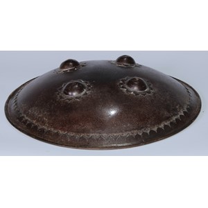 A Persian steel dhal shield, typically domed and applied with four bosses, traces of koftgari decoration, 35cm diam, 19th/early 20th century