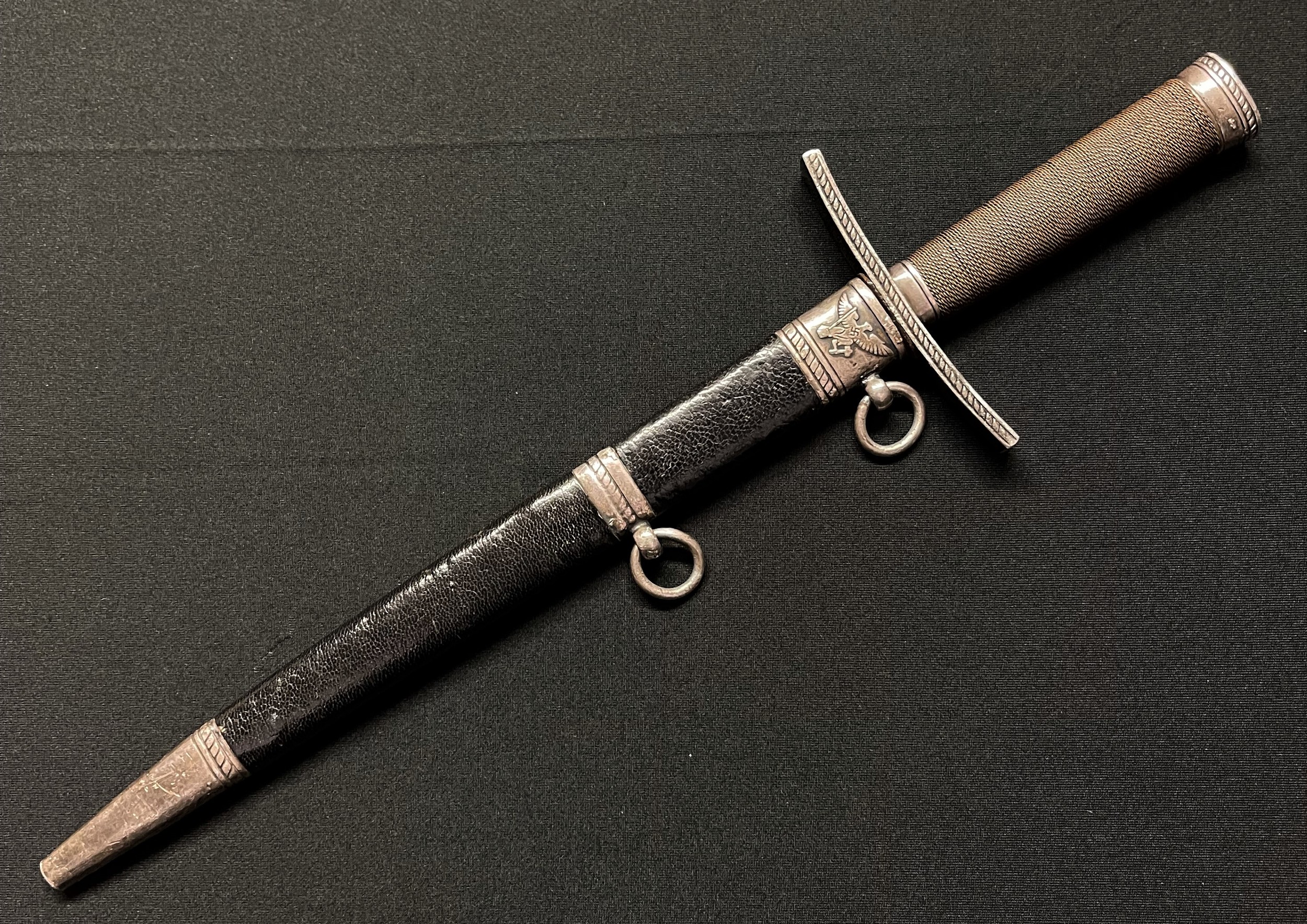 WW2 Third Reich Rare Hitler Jugend Fuhrer Dolch. Hitler Youth Leaders Dagger with double edged 230mm long blade with etched motto "Blut und Ehre!" (Blood and Honour!) along with maker mark for Eickhorn, Soligen. Wire bound grip. Pommel with HJ diamond insignia. Overall length 337mm. Complete with scabbard. WW2 War Souvenir of a member of the Royal Artillery, new to the market.