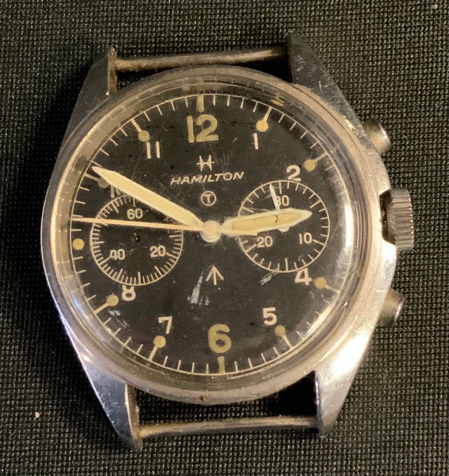 Post War British Military issue 1970s Hamilton Chronometer watch head, black dial, twin subsidiary registers, Arabic numeral and dot baton markers, centre seconds, stainless steel case, marked 0552/924-3306, 1796/72, broad arrow issue stamp, 40mm wide. (faults)