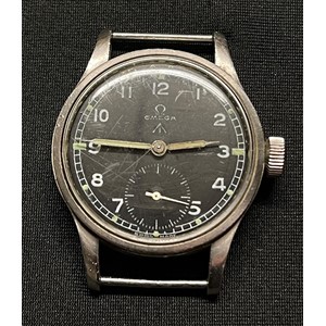 British Army issue Wristwatch by Omega. Case marked WWW (Watch Wristlet Waterproof) along with WD Broad Arrow plus Y23733 and 10687932. Black dial with Arabic numerals Luminous hand and markings to numbers. Separate seconds dial. Marked with trade mark plus "Omega" and "Swiss made". Replacement strap. Part of the so called "Dirty Dozen".