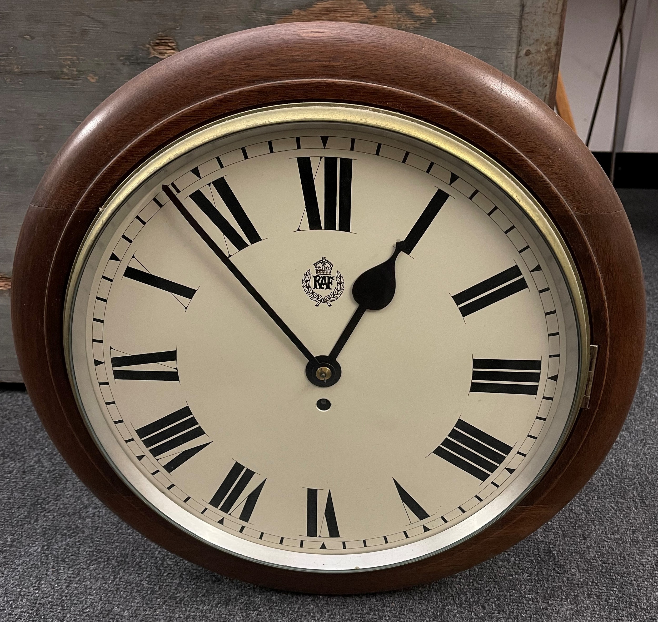 WW2 British RAF Wall Clock with 35cm enamel dial with Roman Numerals and RAF Crest. The wooden case is Air Ministry marked along with the maker name of FW Elliot Ltd. Fusee Movement is also maker marked to FW Elliot along with serial number 17110 and dated 1941. Complete with pendulum and key.