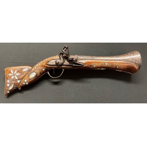 Turkish Flintlock Blunderbuss Pistol. 225mm long barrel. Flare to end of barrel is 64mm wide internally. Overall length 44cm. Brass trigger guard and butt plate. Action is a/f and will only hold at half cock. Woodwork is inlaid with Mother of Pearl. Section 58 (2), no licence required.