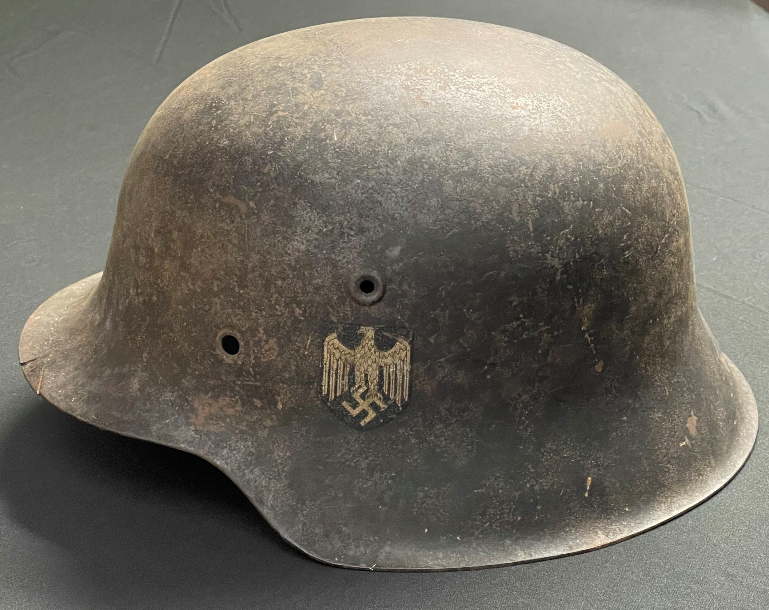 WW2 Third Reich Heer Single Decal M42 Helmet shell. Original paintwork and decal. Slight battle damage to front edge of the helmet. No linerband, liner or chinstrap. Shell is maker marked "ckl" and size marked "66".