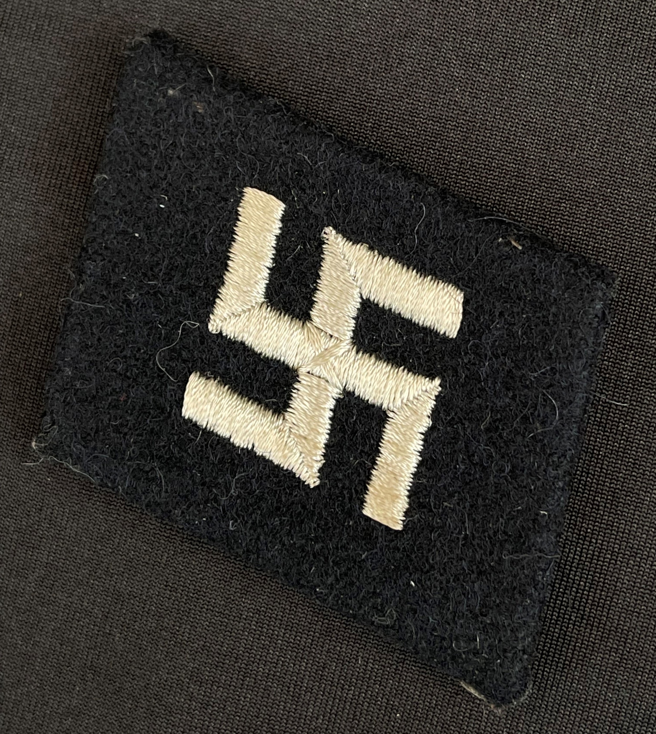 WW2 Third Reich Waffen SS Latvian "Fire Cross" Swastika Collar Tab for 19th SS Latvian Division. Dachau pattern tab in unissued condition.
