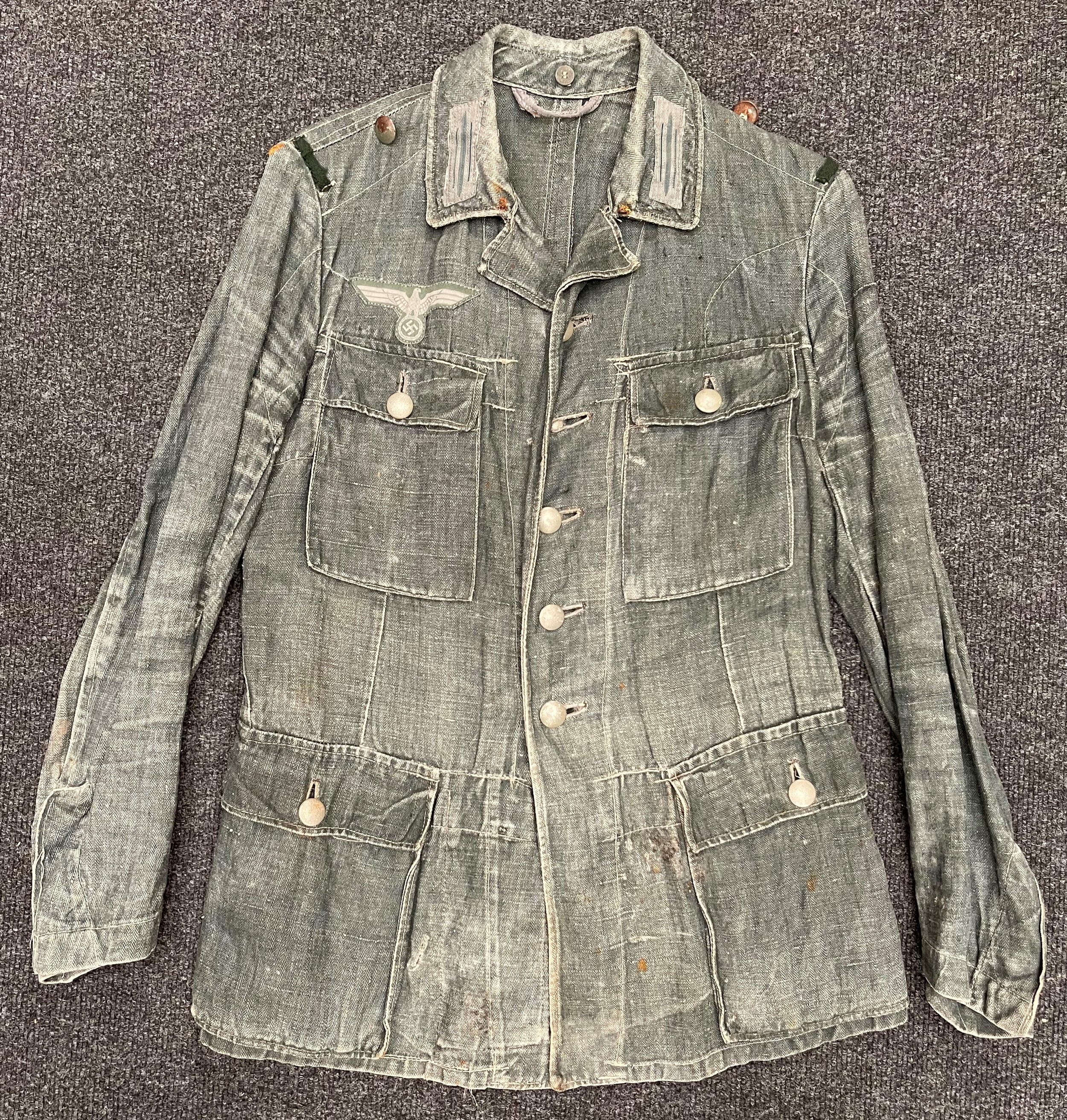 WW2 Third Reich Heer HBT Summer Weight Feldbluse. Breast eagle is originally sewn. Complete with all buttons. Shoulder strap loops replaced. Ink markings faded. Internal belt hook support straps have been removed.