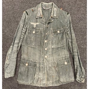 WW2 Third Reich Heer HBT Summer Weight Feldbluse. Breast eagle is originally sewn. Complete with all buttons. Shoulder strap loops replaced. Ink markings faded. Internal belt hook support straps have been removed.