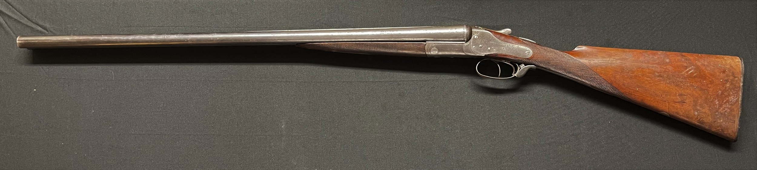 Holland and Holland 12 Bore Side by Side Shotgun with 712mm long barrels, serial no 6058. Marked Climax Safety Hammerless. Overall length 113cm. Top rib is marked "EW Ward, Kettering". Note: Buyer must hold a valid Shotgun Certificate or be a Registered Firearms dealer.