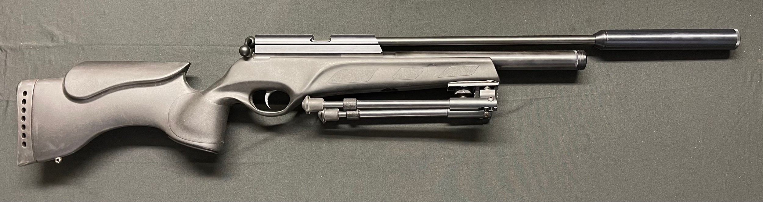 BSA Prototype .25 cal / 6.35 cal Air Rifle complete with Bipod. No serial number. Barrel length 385mm. Fitted with a moderator. Black ABS Stock. Overall length 102cm. Complete with gun slip.