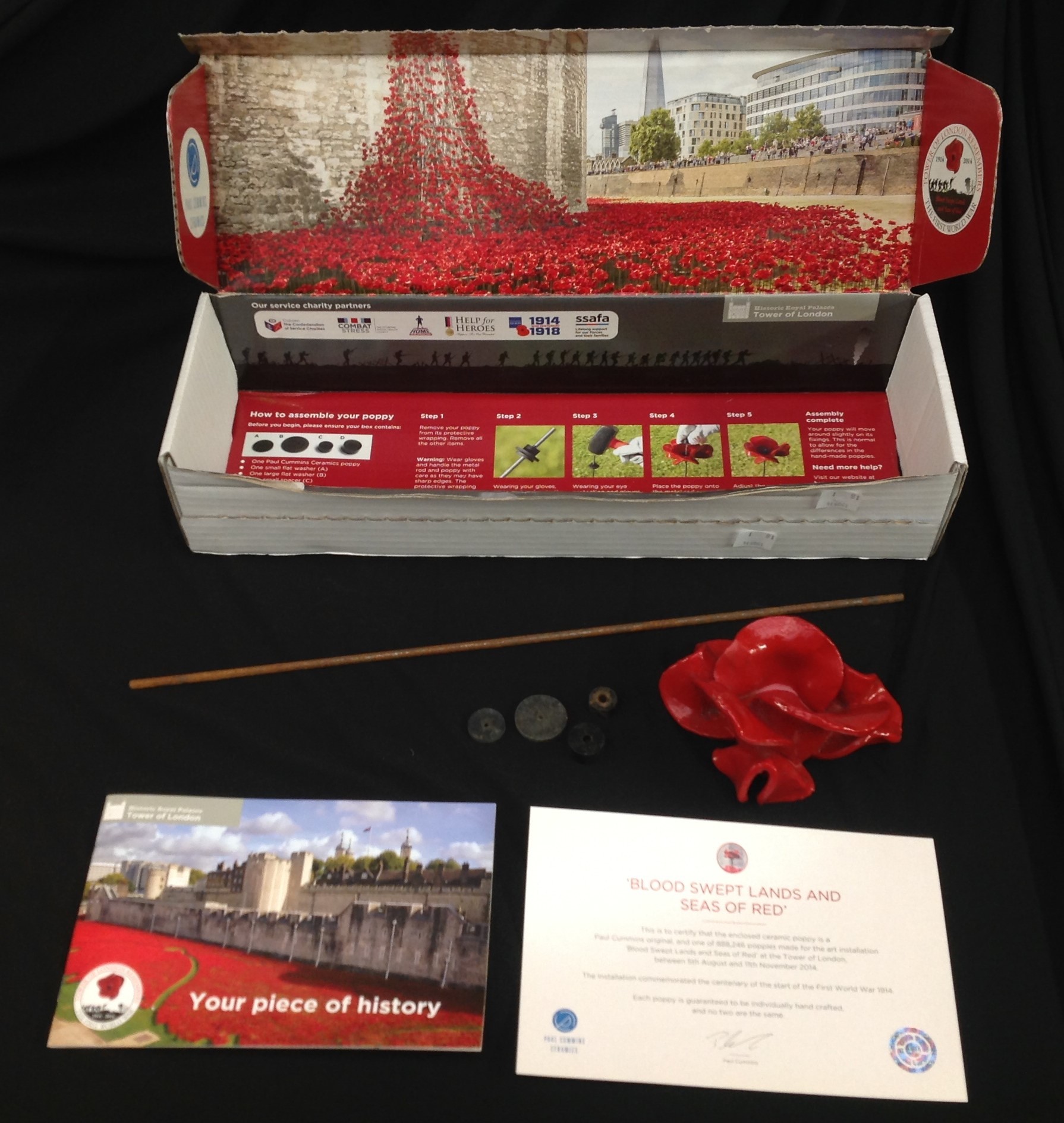 A Royal British Legion Centenary ceramic poppy by Paul Cummins made for the art installation at the Tower of London, boxed with certificate