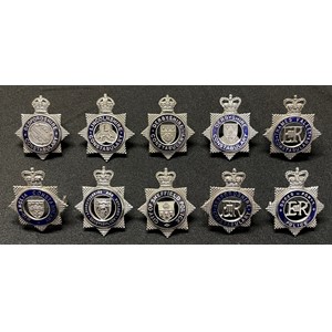 A collection of Police Officers cap badges to include: Kings Crown Derbyshire Constabulary: Kings Crown Lincolnshire Constabulary: Kings Crown Bedfordshire Constabulary: Queens Crown Dyfed-Powys Police: Queens Crown Derbyshire Constabulary: Queens Crown Mid Anglia Constabulary: Queens Crown Leicestershire & Rutland Constabulary: Queens Crown City of Sheffield Police: Queens Crown Thames Valley Police: Queens Crown Bedfordshire Constabulary . (10)