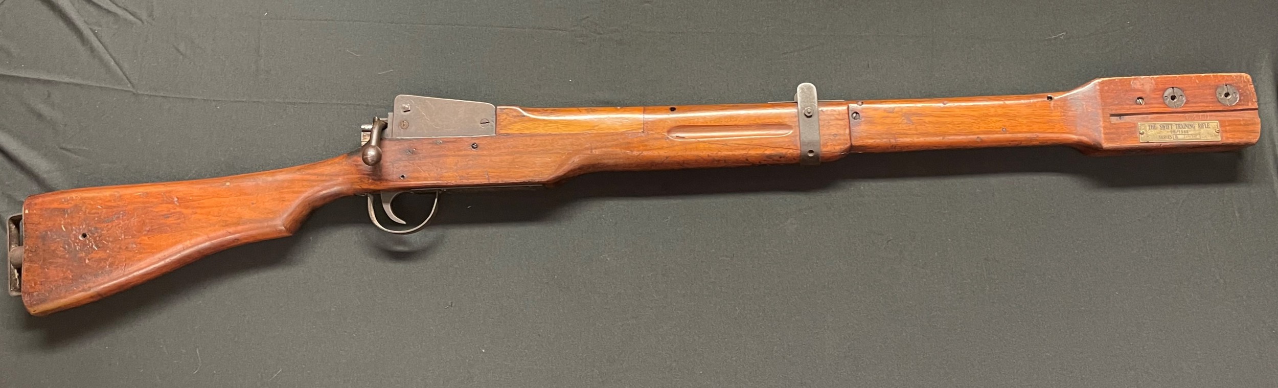 WW2 British Swift Training Rifle 9B/1588 Series B1000. Length 120cm. Complete and in working order. Along with rare original paper targets. Note: Not a Firearm and free from any licence requirements in the UK.