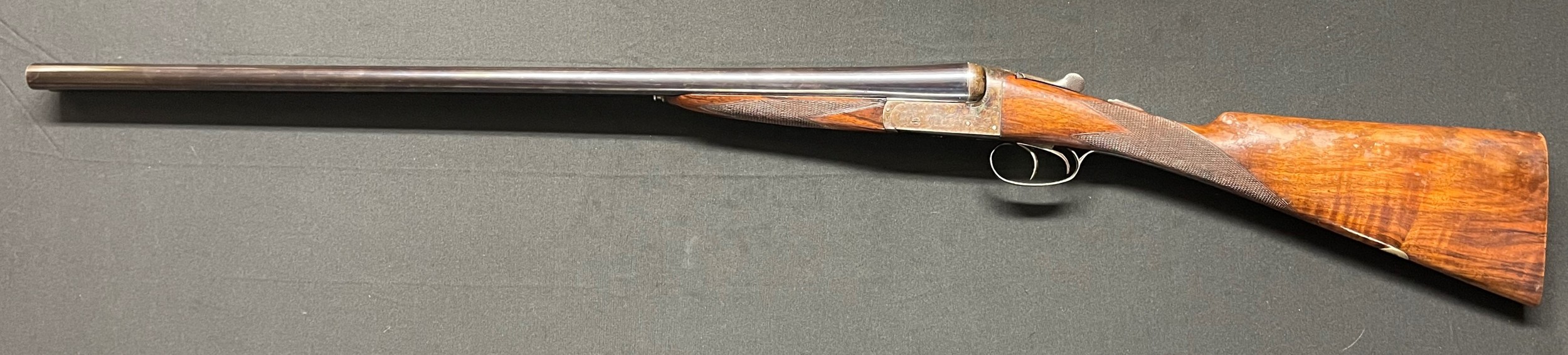 12 Bore Side by Side Shotgun with 713mm long barrels by W Metcalfe, Richmond, Yorks. Serial no 1670. Overall length 113.5cm. NOTE: Buyer must hold a valid Shotgun Certificate or be a Registered Firearms Dealer.