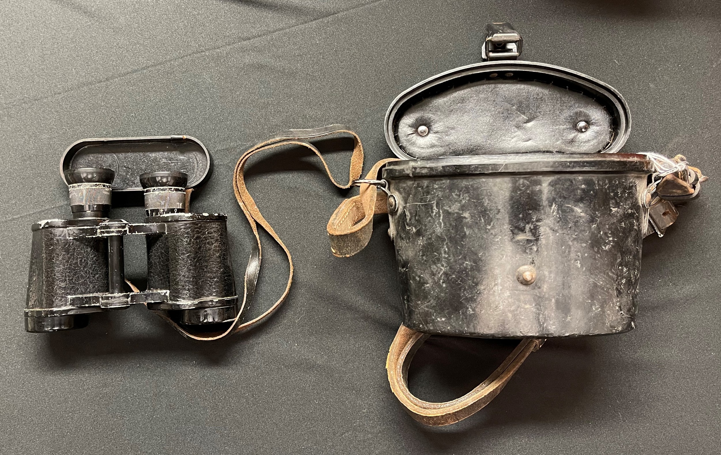 WW2 Third Reich 6 x 30 Dienstglass Binoculars. H/6400. Serial number 3384. Maker code marked "gkp" KF. Complete with original leather neck strap, bakelite lens cover, bakelite carrying case and leather strap. Makers code markings inside the case.