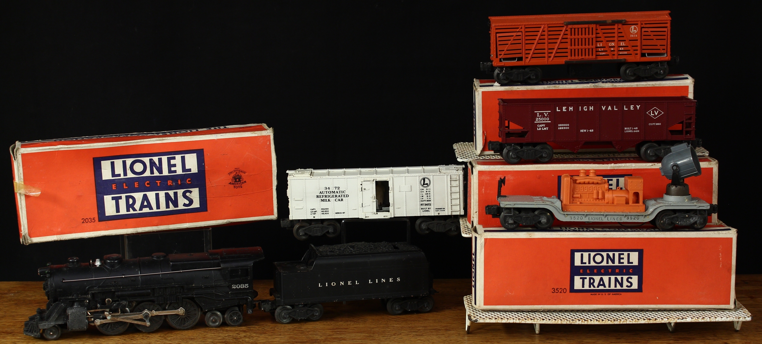 Lionel Electric Trains O27 Gauge, comprising 2035 K-4 2-6-4 steam locomotive, black livery, No.2035, boxed and Lionel Lines eight wheel tender, unboxed; 3461 automatic lumber car, boxed; 3520 operating searchlight car, boxed; 3656 operating cattle car, boxed; 6257 caboose, boxed; 6456 red hopper car, boxed; 6462 gondola car, boxed; others including Lionel track, remote control switches, accessories and literature (large quantity)