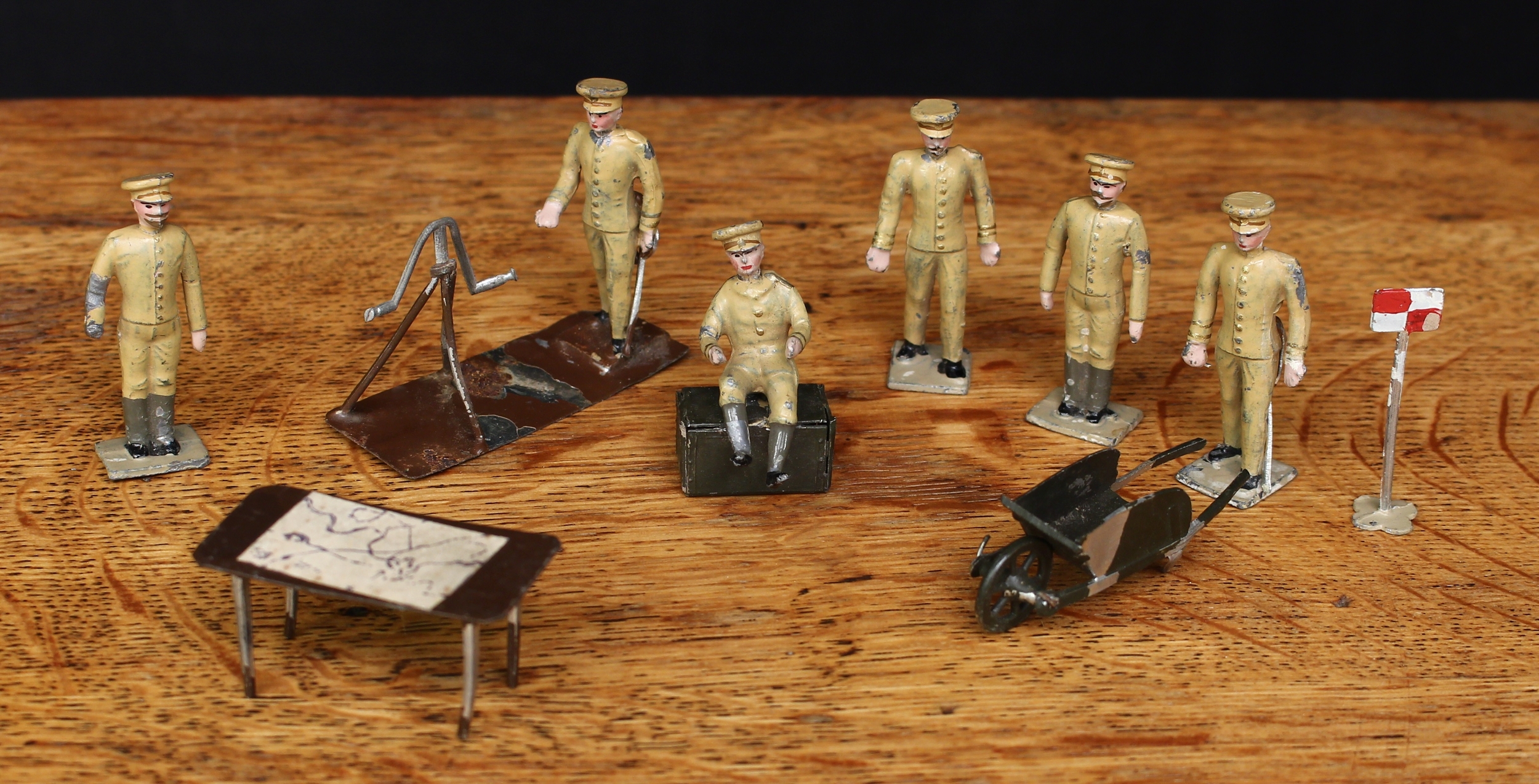 C.B.G. Mignot (Paris, France) or similar, a collection of British army lead figures and accessories, each wearing khaki uniform with peaked caps, various poses including a soldier seated on an artillery box, unmarked rectangular bases, each unboxed (9)