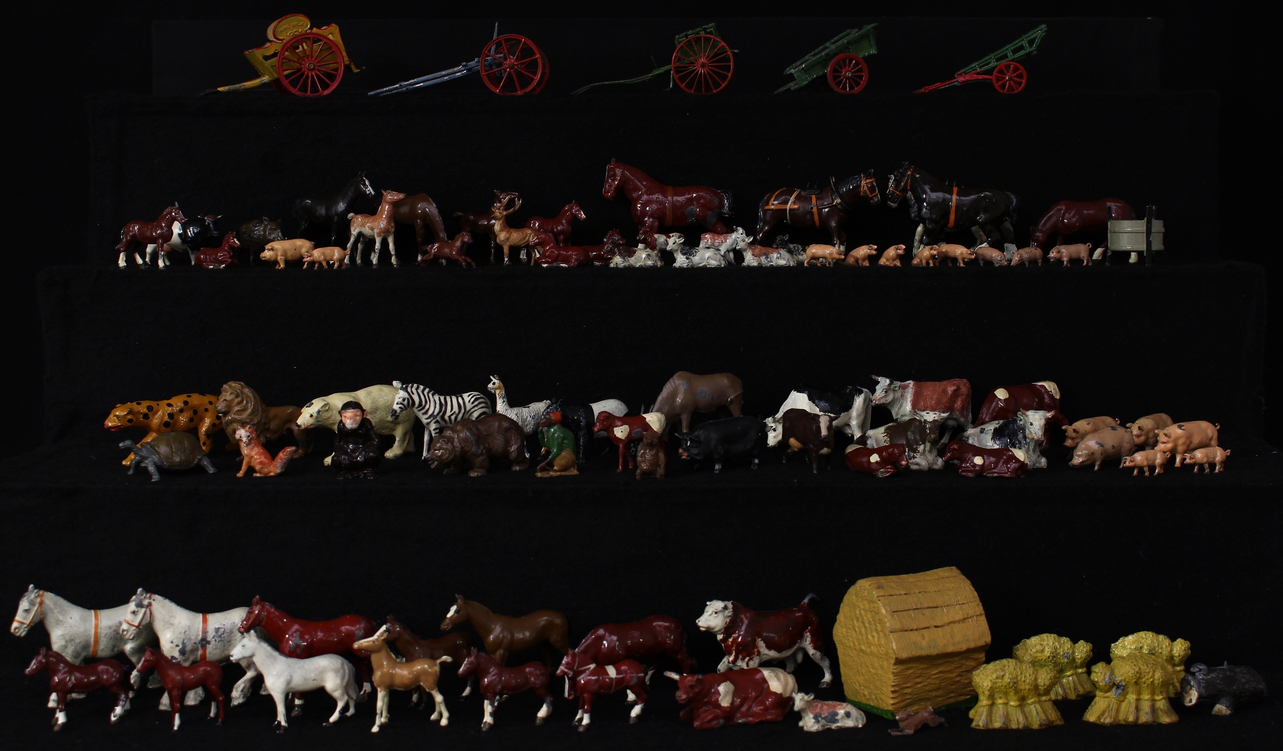An extensive collection of 20th century painted lead Zoo and Farmyard animals, civilian figures and accessories, mostly by W Britain (Britains), comprising Horses, Pigs, Cows, Swans, Chickens, Lambs, Sheep, Dogs etc (large quantity)