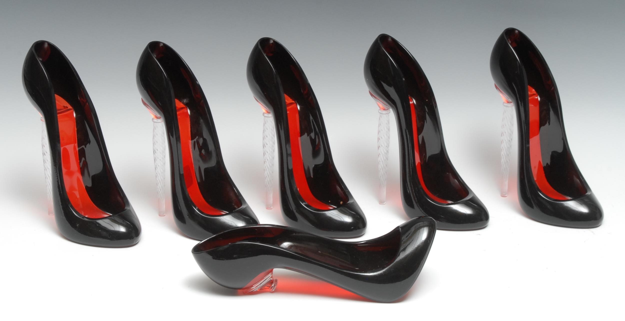 A set of six French novelty crystal champagne flutes, as lady's stiletto shoes, Le Rituel designed by Christian Louboutin for Piper-Heidsieck Champagne, each 19.5cm high, cased en suite