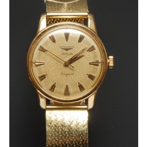Longines - a Conquest automatic gold cased wristwatch, textured dial, centre seconds, shaped block baton markers, automatic movement, indistinctly marked case, Cartier Paris 18ct gold mesh link bracelet strap, deployment buckle, 101.8g gross