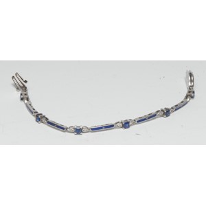 A Faberge limited edition 18ct white gold sapphire, diamond and blue enamel bracelet, inset with twelve diamonds and six blue sapphires, total stone weights diamond 0.28ct, sapphires 1.34ct, signed, 14/500, stamped 750, 16.5cm long, 17.8g gross, with certificate.